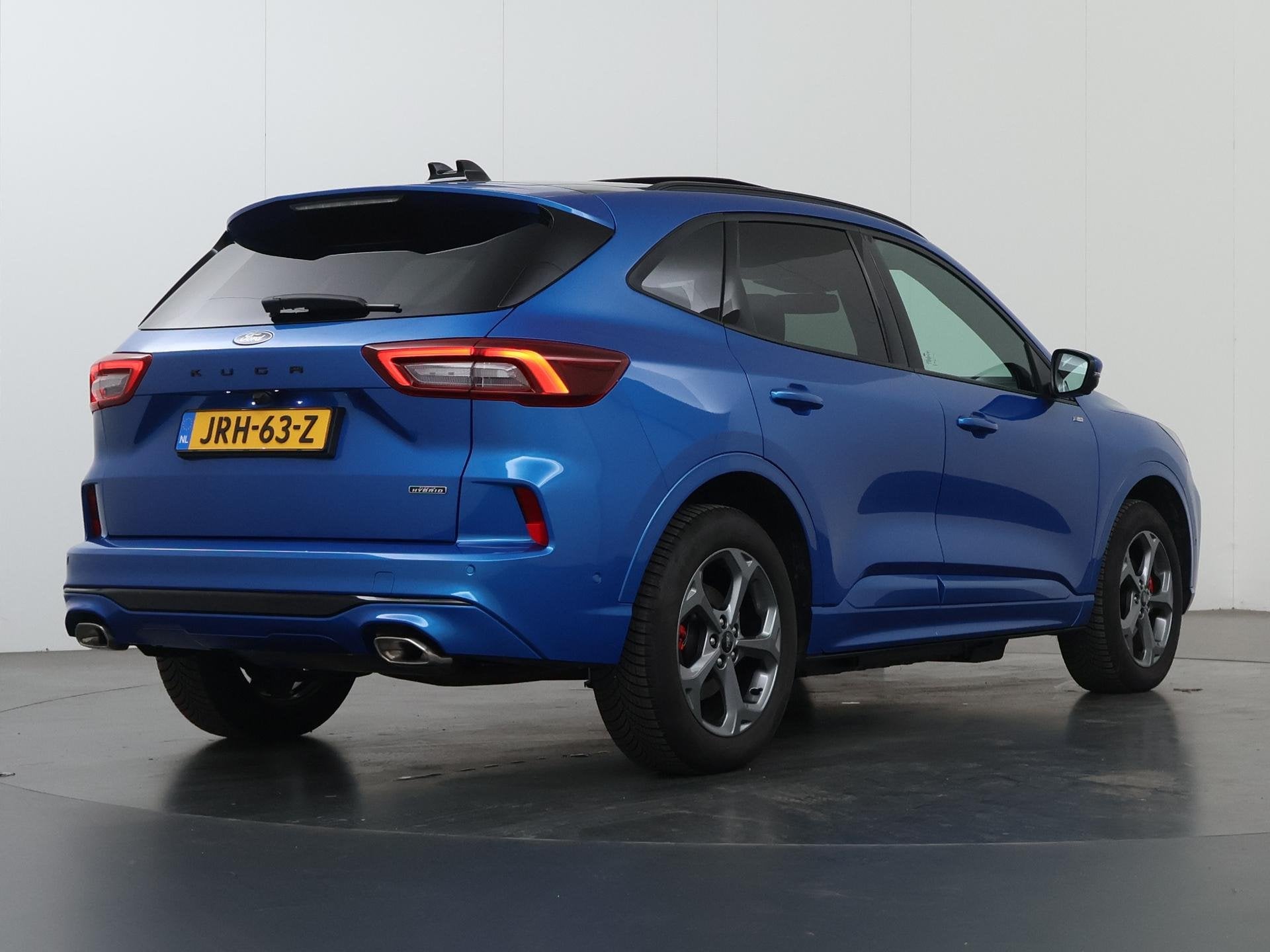 Ford Kuga 2.5 PHEV ST-Line X | Elekt inklapbare Trekhaak | P, Auto's, Ford, 14 kWh, Gebruikt, Blauw, Leder en Stof