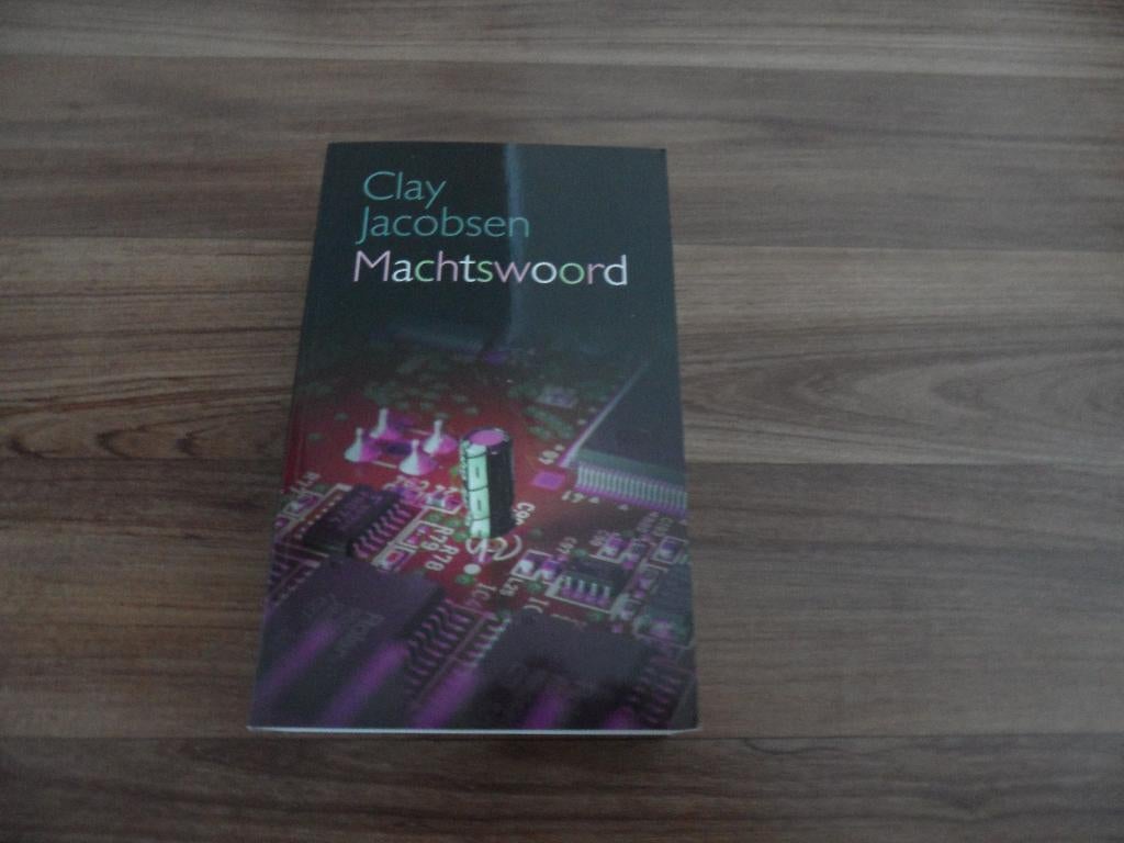 Machtswoord- Clay Jacobsen, Boeken, Thrillers, Zo goed als nieuw, Ophalen of Verzenden