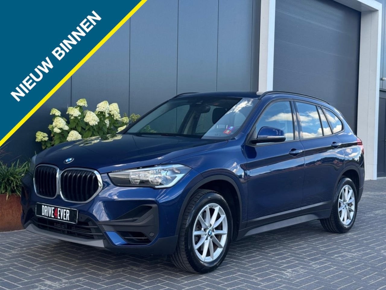 BMW X1 1.8i sDrive Executive | Trekhaak | Groot scherm, Auto's, BMW, 136 pk, Gebruikt, Zwart, Met garantie (alle)