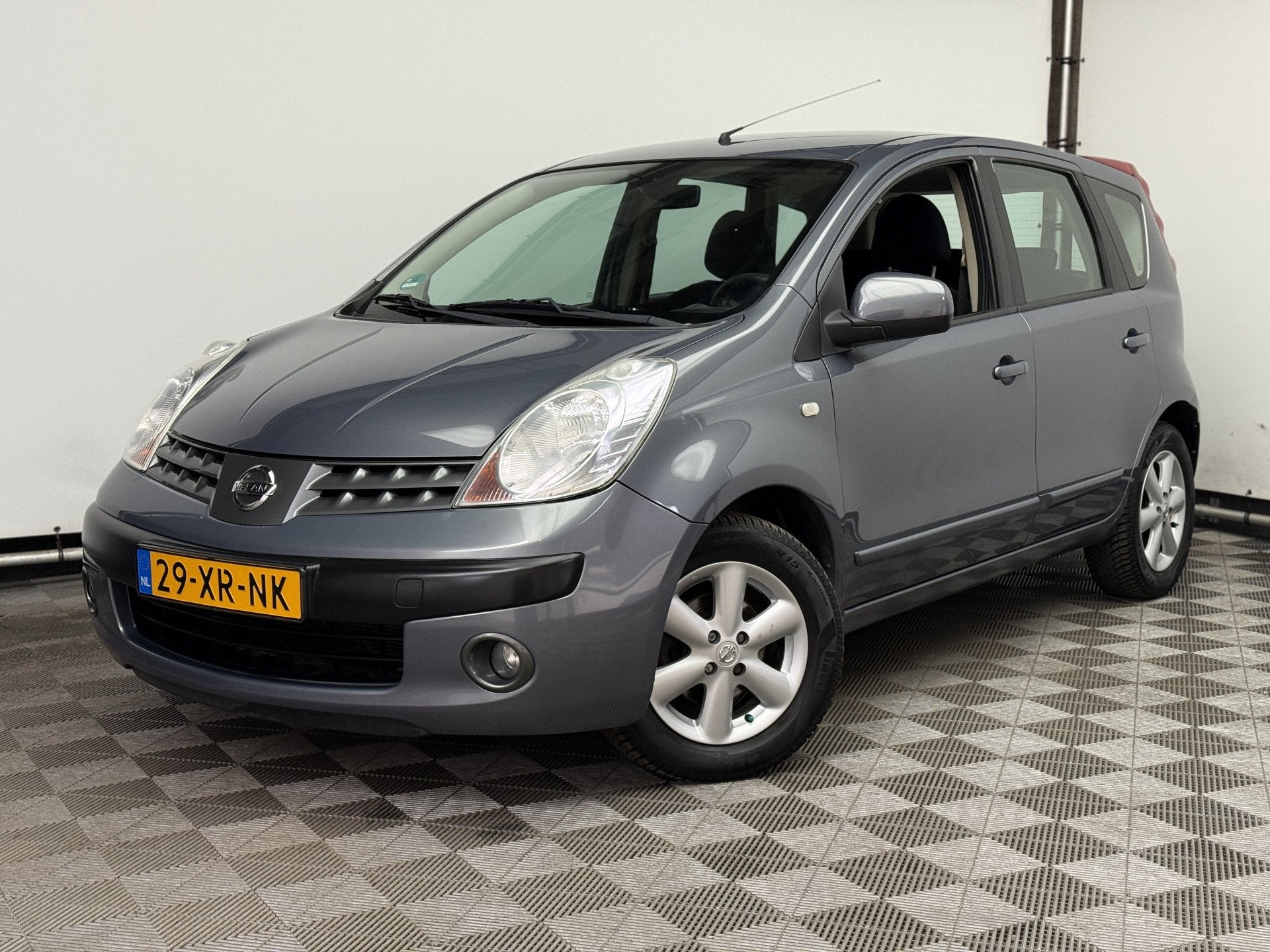 Nissan Note 1.4 Acenta ECC Trekhaak NL Auto (bj 2007), Auto's, Nissan, Voorwielaandrijving, Stof, 4 cilinders, Met garantie (alle)