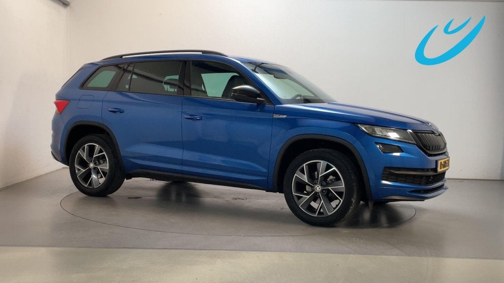 Skoda Kodiaq 1.5 TSI 150pk DSG Sportline Business Sportstoel, Auto's, Skoda, Automatische klimaatregeling, 4 cilinders, Blauw