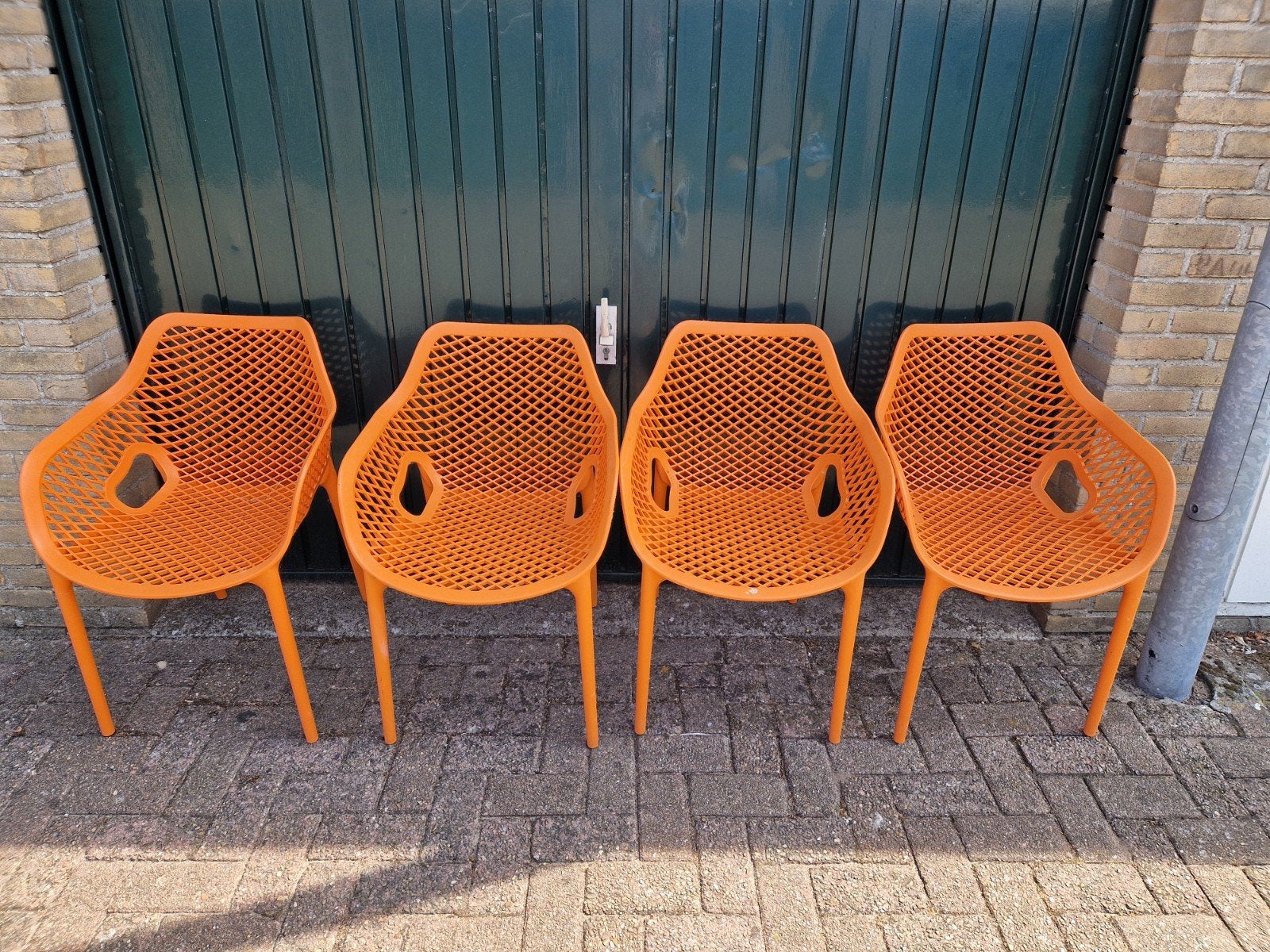 4x Tuinstoelen Air XL oranje Siësta, Ophalen of Verzenden, Gebruikt, Kunststof, Stapelbaar