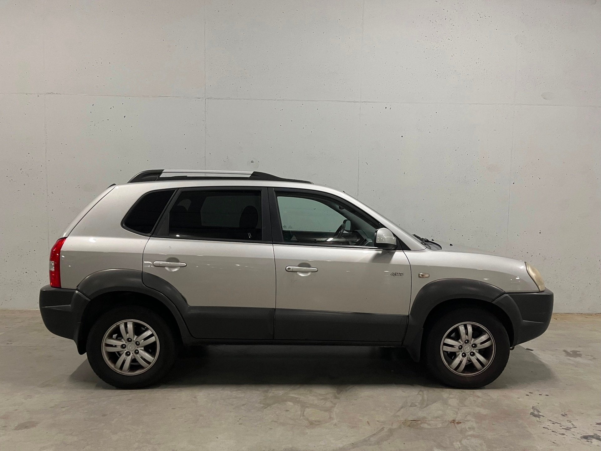 Hyundai Tucson 2.7i V6 4WD Style Automaat Clima Trekhaak, Auto's, Automaat, Stof, Gebruikt, Stoelverwarming