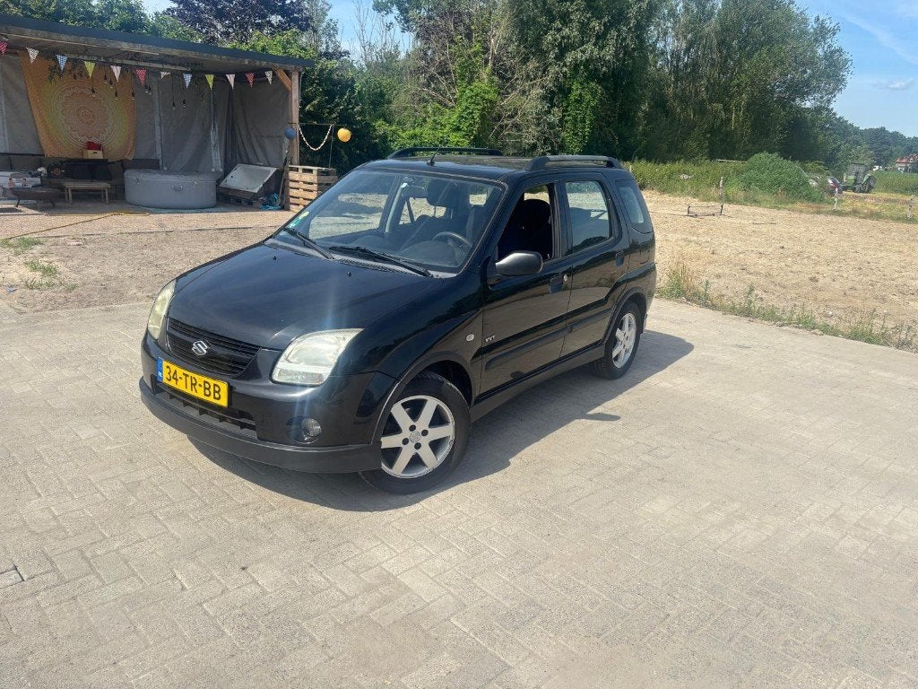 Suzuki Ignis 1.5 5D 2006 Zwart, Auto's, Voorwielaandrijving, 4 cilinders, Ignis, Zwart