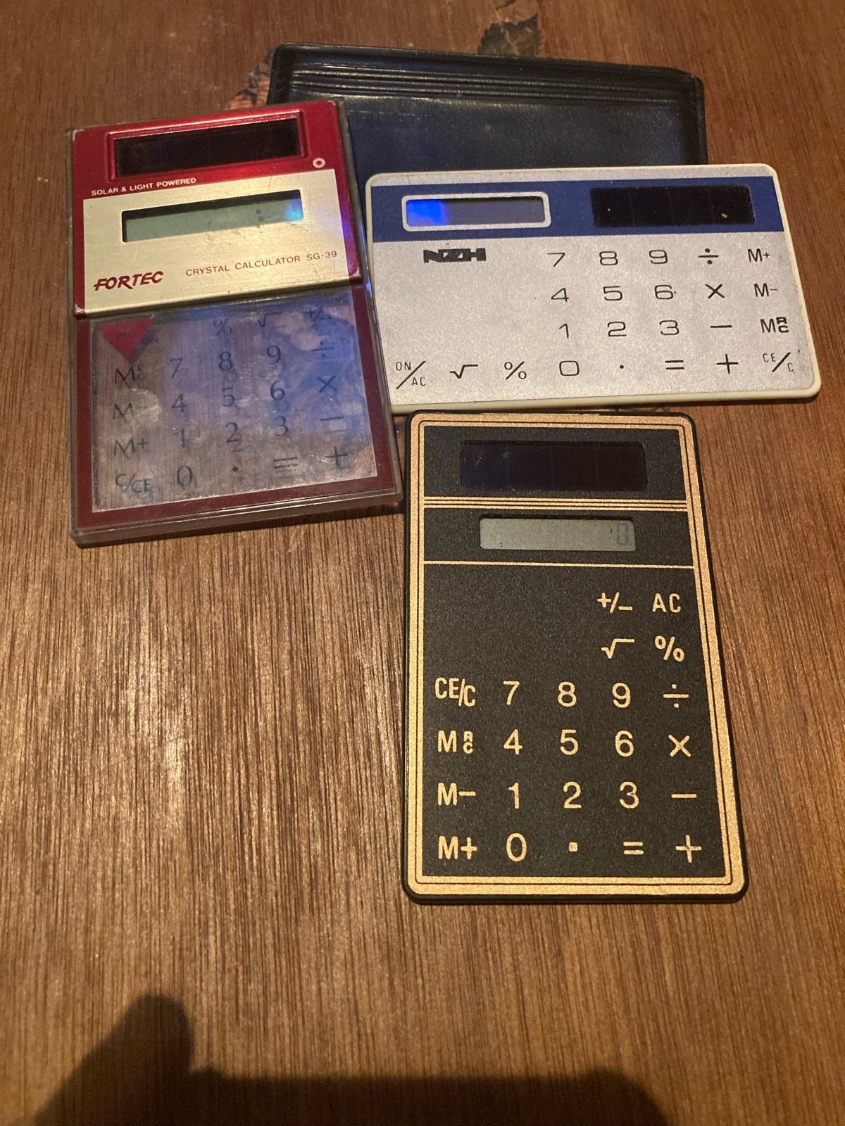 three vintage, ultra-thin pocket calculators from the 1980s, Ophalen