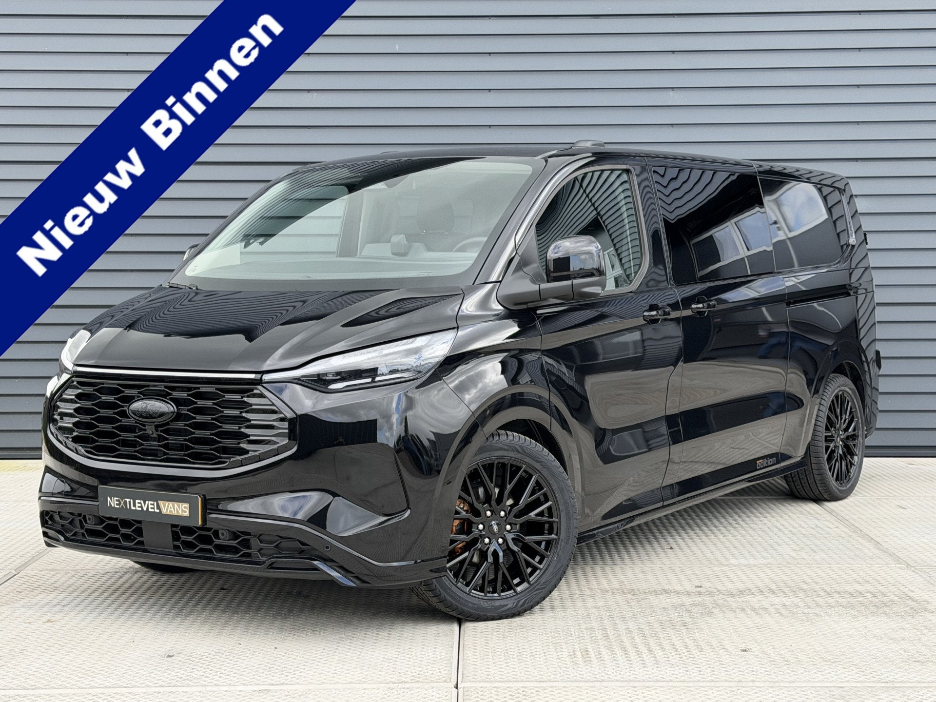 Ford E-Transit Cust. 320 L2H1 Sport 71 kWh DC | Next Level E, Auto's, Automaat, Achterwielaandrijving, Gebruikt, Zwart