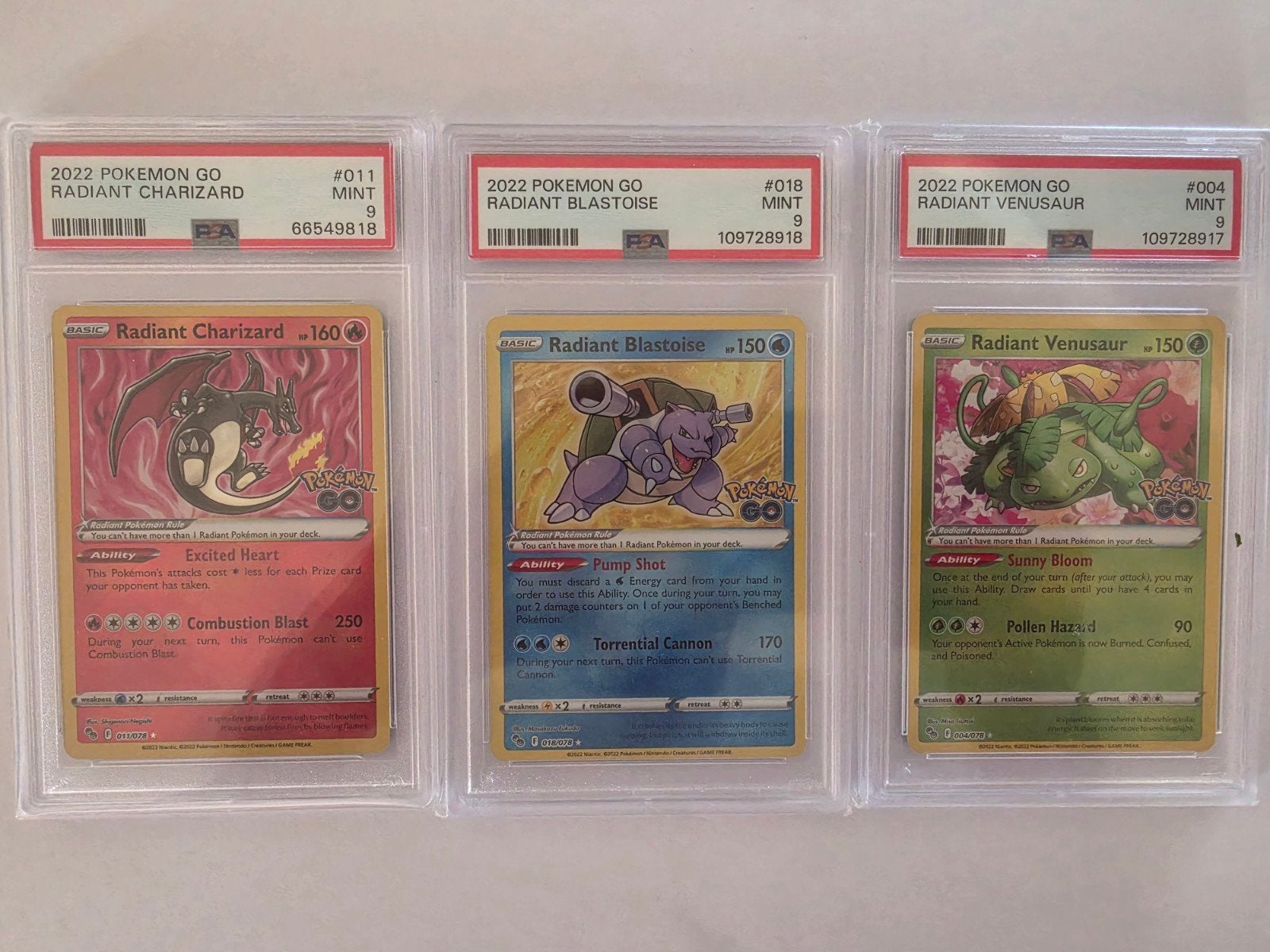 PSA 9 Radiant Charizard, Blastoise, Venusaur, Hobby en Vrije tijd, Ophalen of Verzenden, Zo goed als nieuw, Meerdere kaarten