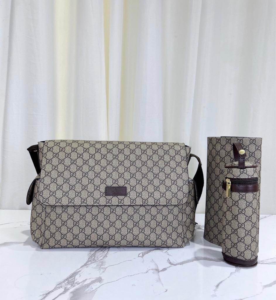 Gucci luiertas, inclusief verschoonmat en fleshouder, Kinderen en Baby's, Ophalen of Verzenden, Nieuw