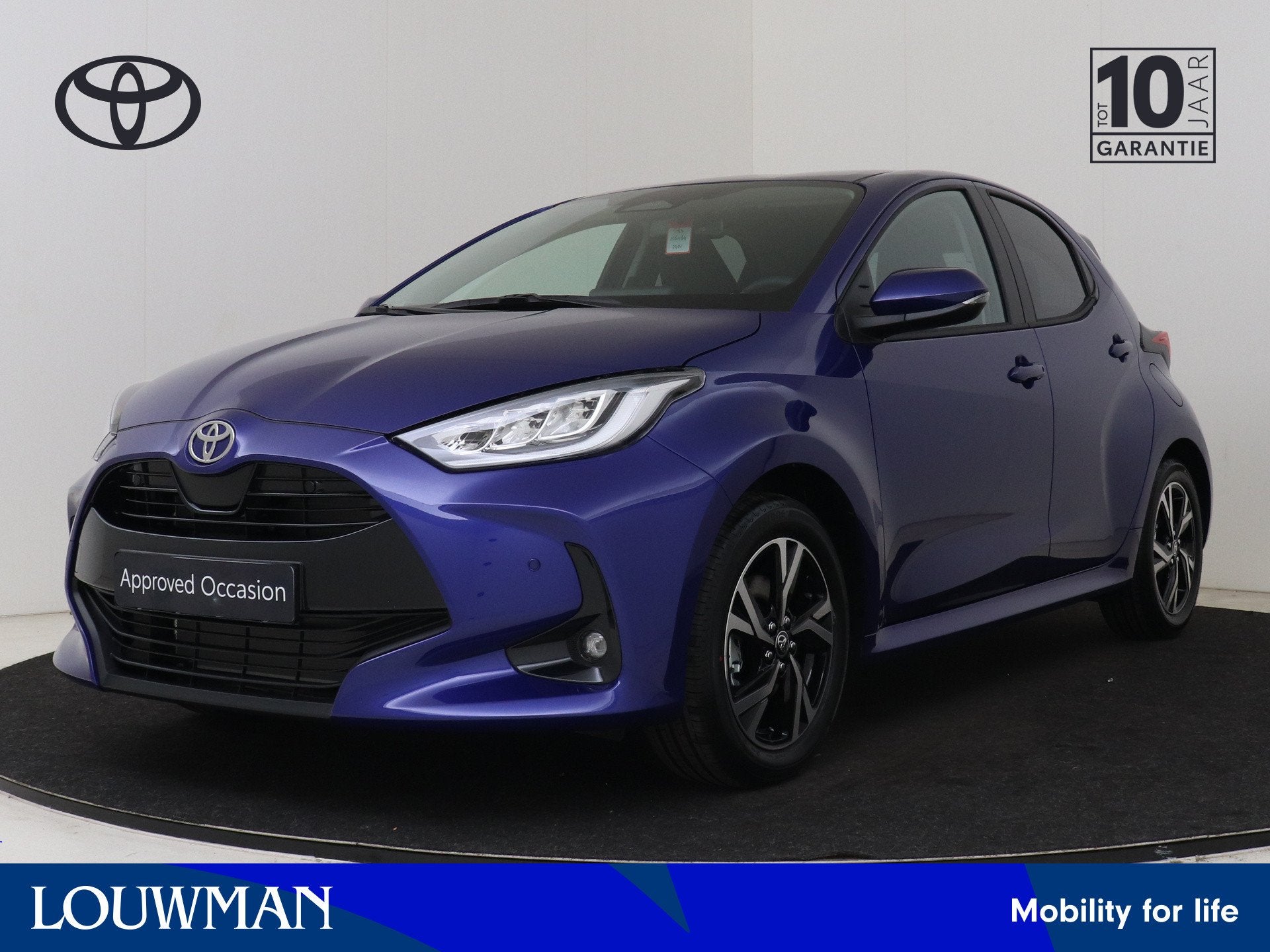 Toyota Yaris 1.5 Hybrid 115 Dynamic (bj 2025, automaat), Auto's, 12 maanden, Automatische klimaatregeling, Blauw, Bedrijf