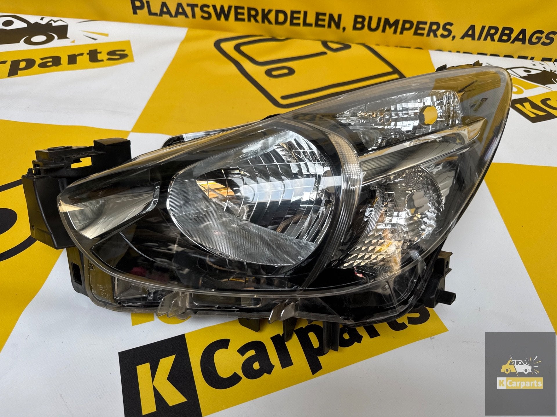 Koplamp Mazda 2 Links Halogeen DB5J51040 koplamp, Info@fabrikant.eu, Fabrikantstraat 1
1000 AA  Amsterdam, NL, Ophalen of Verzenden