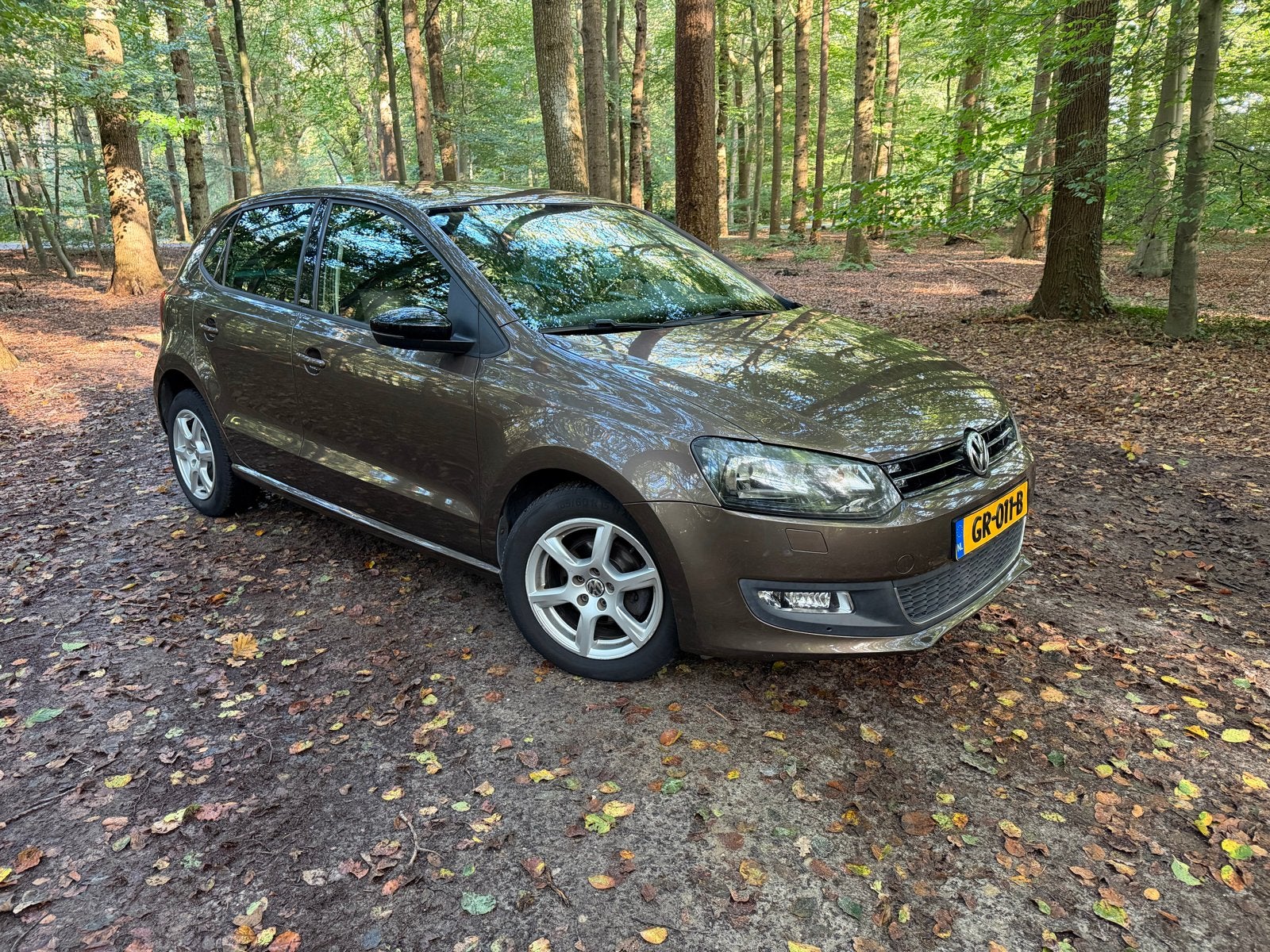 Volkswagen Polo 1.2 51KW 2011 Bruin, STYLE, Auto's, Voorwielaandrijving, 972 kg, 40 €/maand, Bruin