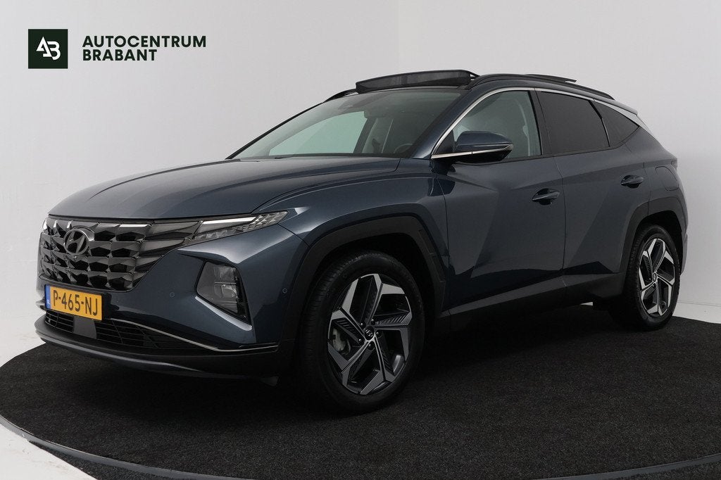 Hyundai Tucson 1.6 T-GDI HEV Premium Sky (PANORAMADAK, TREKH, Auto's, Hyundai, Gebruikt, 4 cilinders, Blauw, 1650 kg