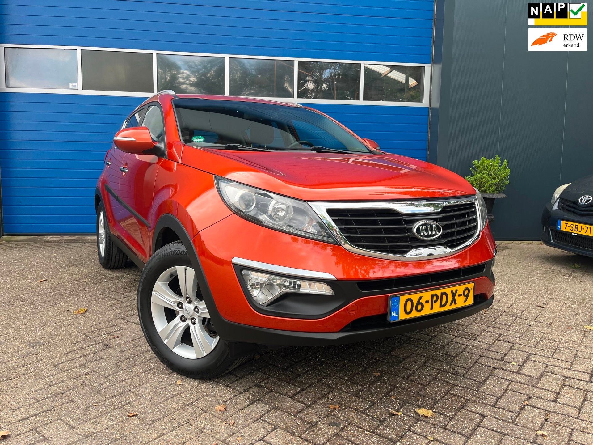 Kia Sportage 2.0 X-ecutive Plus Pack Automaat, Auto's, Gebruikt, Zwart, Leder en Stof, 163 pk