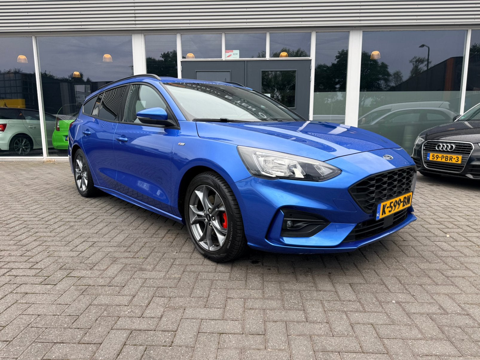 Ford Focus 1.0 Hybrid St-Line Business X 125pk 2020 Blauw, Auto's, Dealer onderhouden, Blauw, 19 km/l, Hybride Elektrisch/Benzine