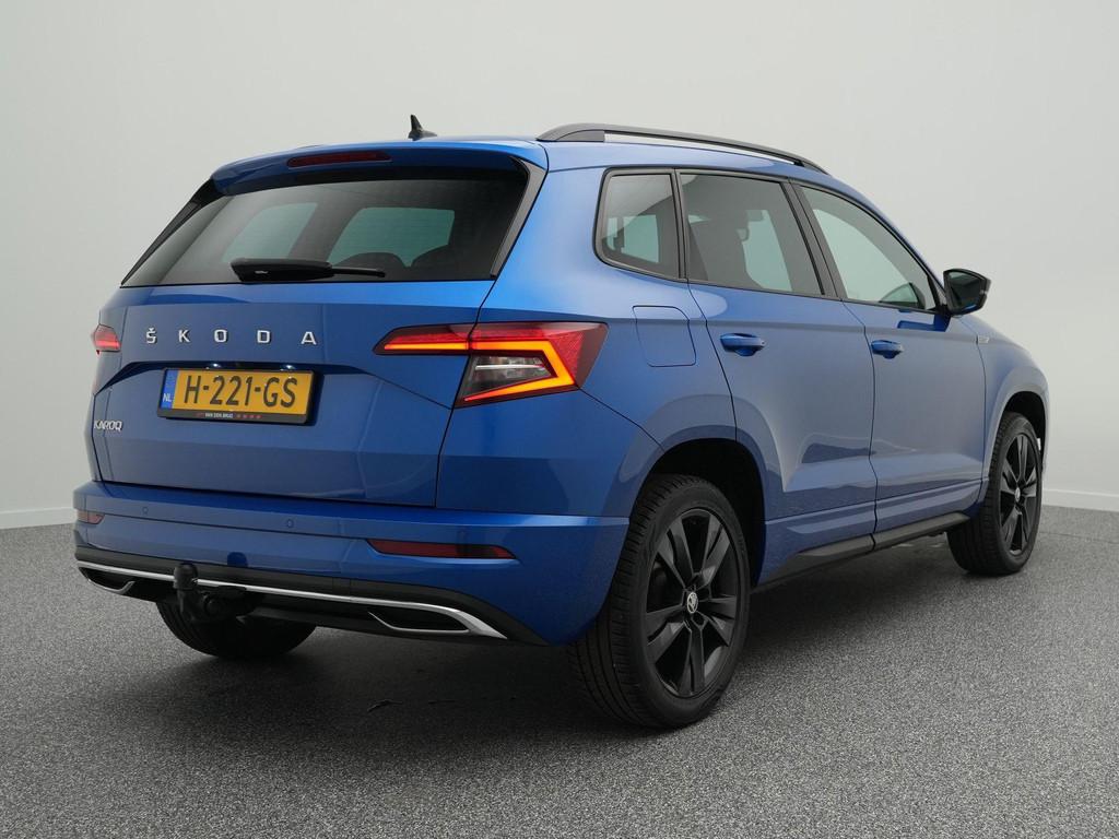 Skoda Karoq 1.5 TSI 150pk AUTOMAAT Sportline Business | Trek, Auto's, Stof, 4 cilinders, Blauw, Bedrijf