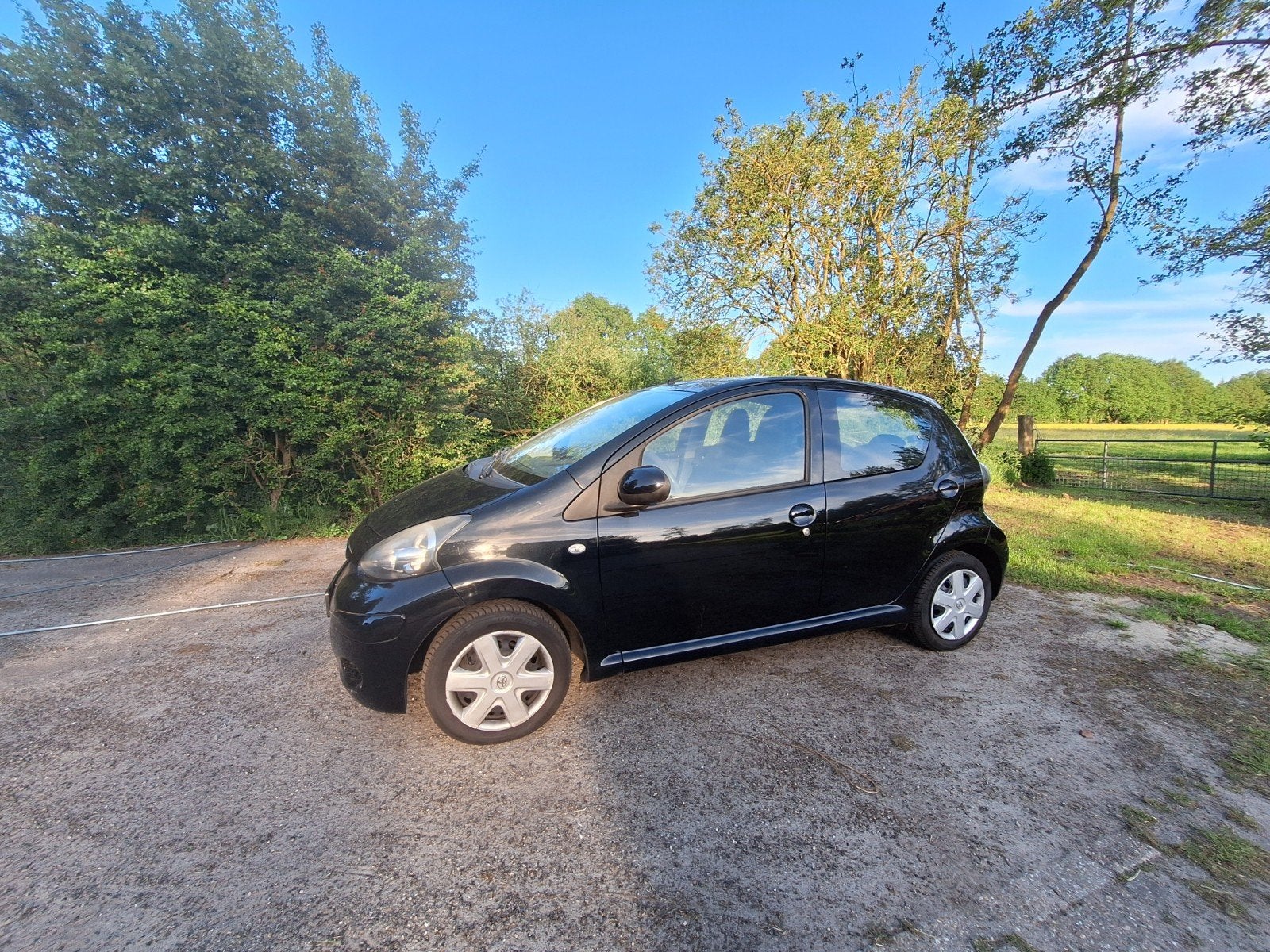 Toyota Aygo 1.0 12V Vvt-i 5DRS 2010 Zwart, Auto's, Voorwielaandrijving, 4 stoelen, Origineel Nederlands, Bedrijf
