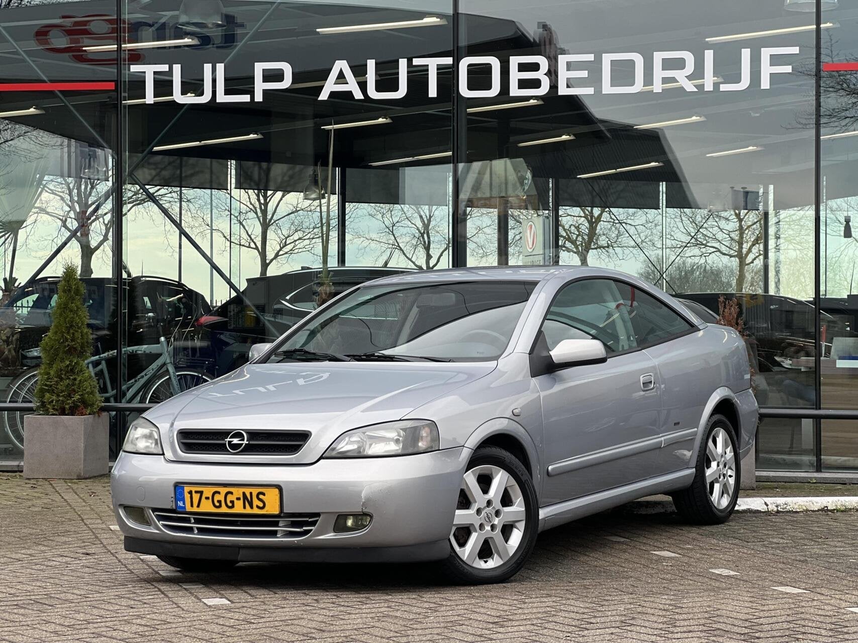 Opel Astra Coupé 1.8-16V Airco Lage km stand NAP, Auto's, Opel, 1160 kg, Stof, Zwart, 4 cilinders