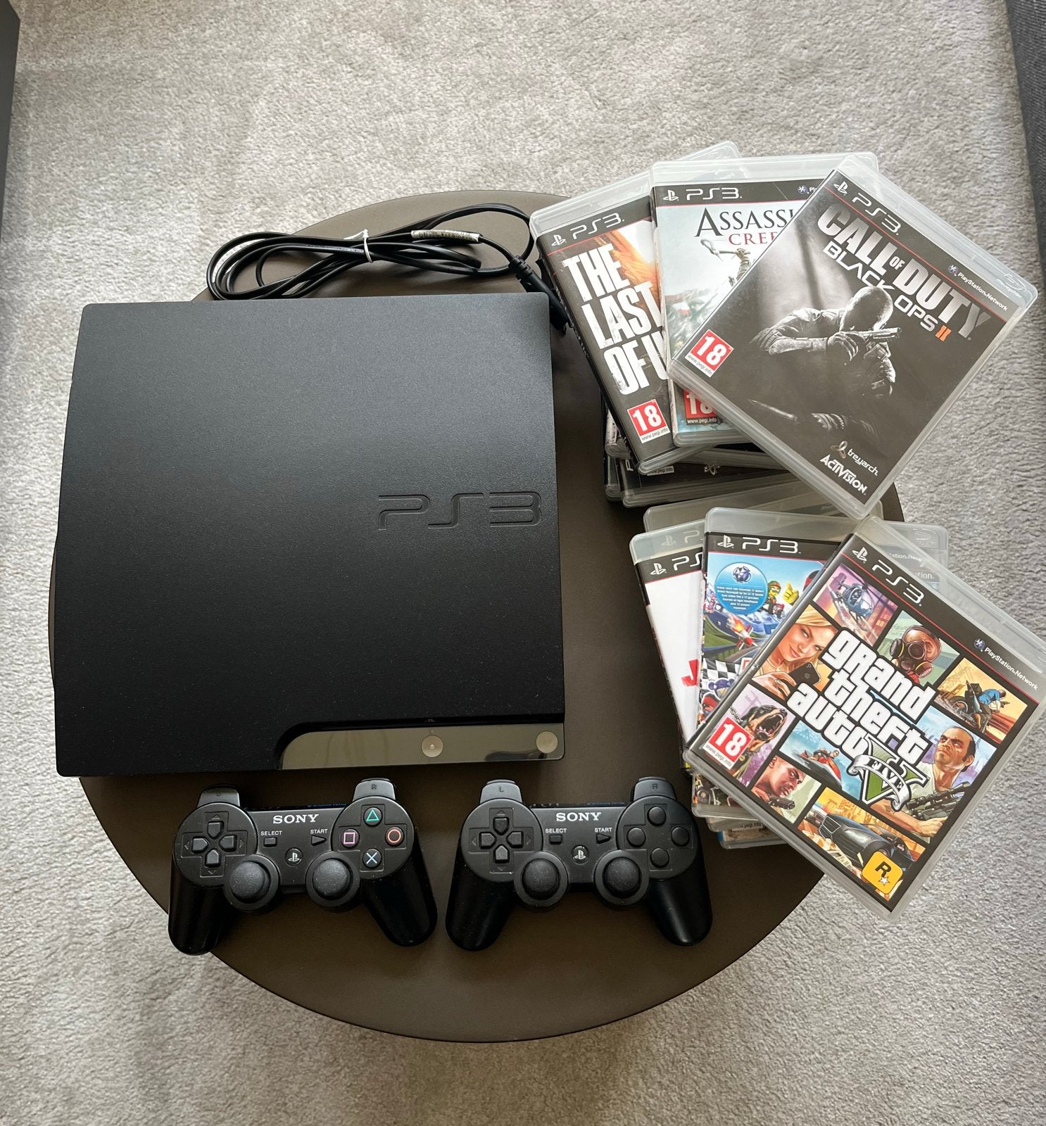 PlayStation 3 inclusief 2 controllers en 15 games, Spelcomputers en Games, Met games, Super Slim, Met 2 controllers, Ophalen of Verzenden