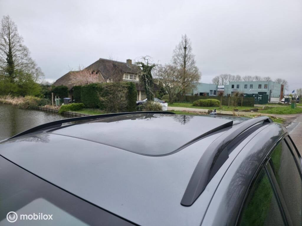 Skoda Karoq 1.5 TSI ACT Sportline / Pano / Carplay / Camera, Stof, Zwart, 4 cilinders, 150 pk