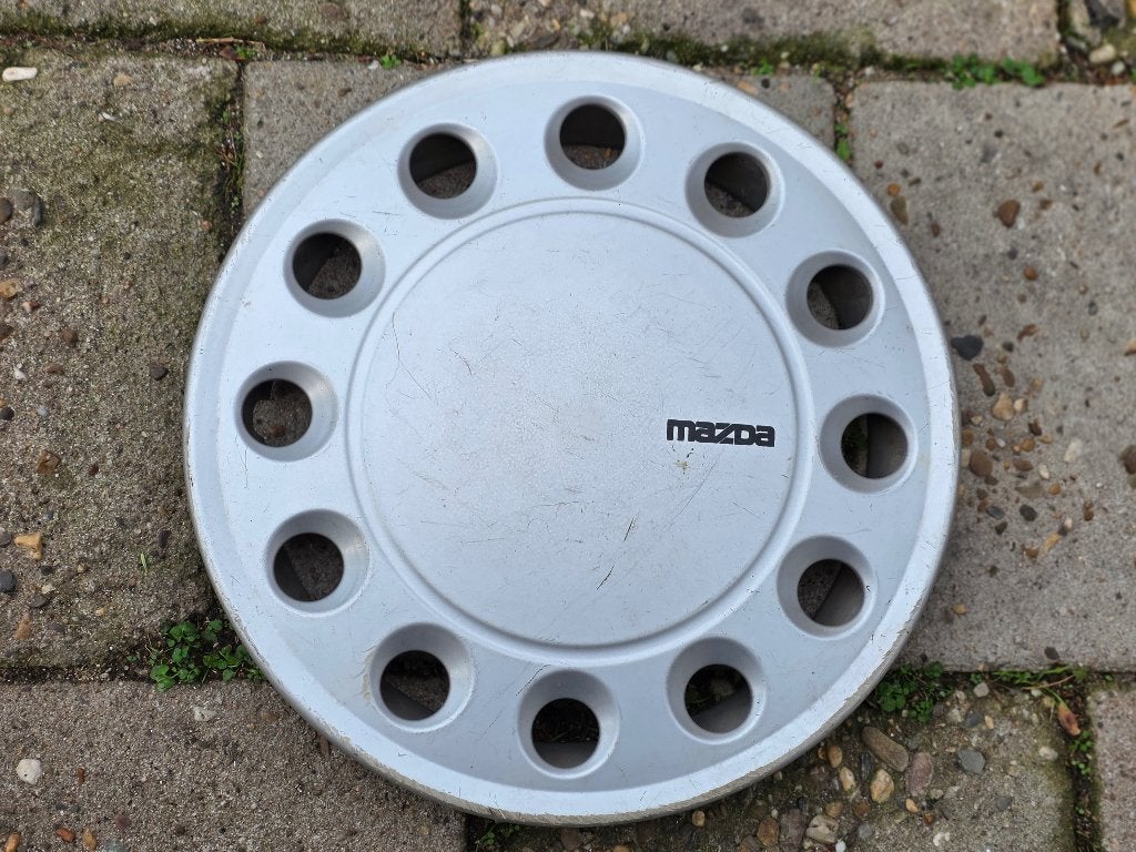 1 losse originele wieldop Mazda 323 13 inch (Model 1), Auto diversen, Ophalen of Verzenden, Gebruikt