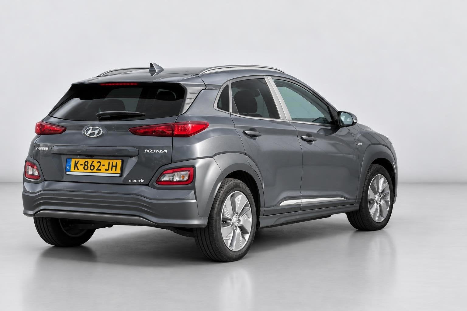 Hyundai Kona EV Fashion 64 kWh SOH 99.5% |FASE 3|1E EIG|DEAL, Dealer onderhouden, Stof, Gebruikt, Zwart
