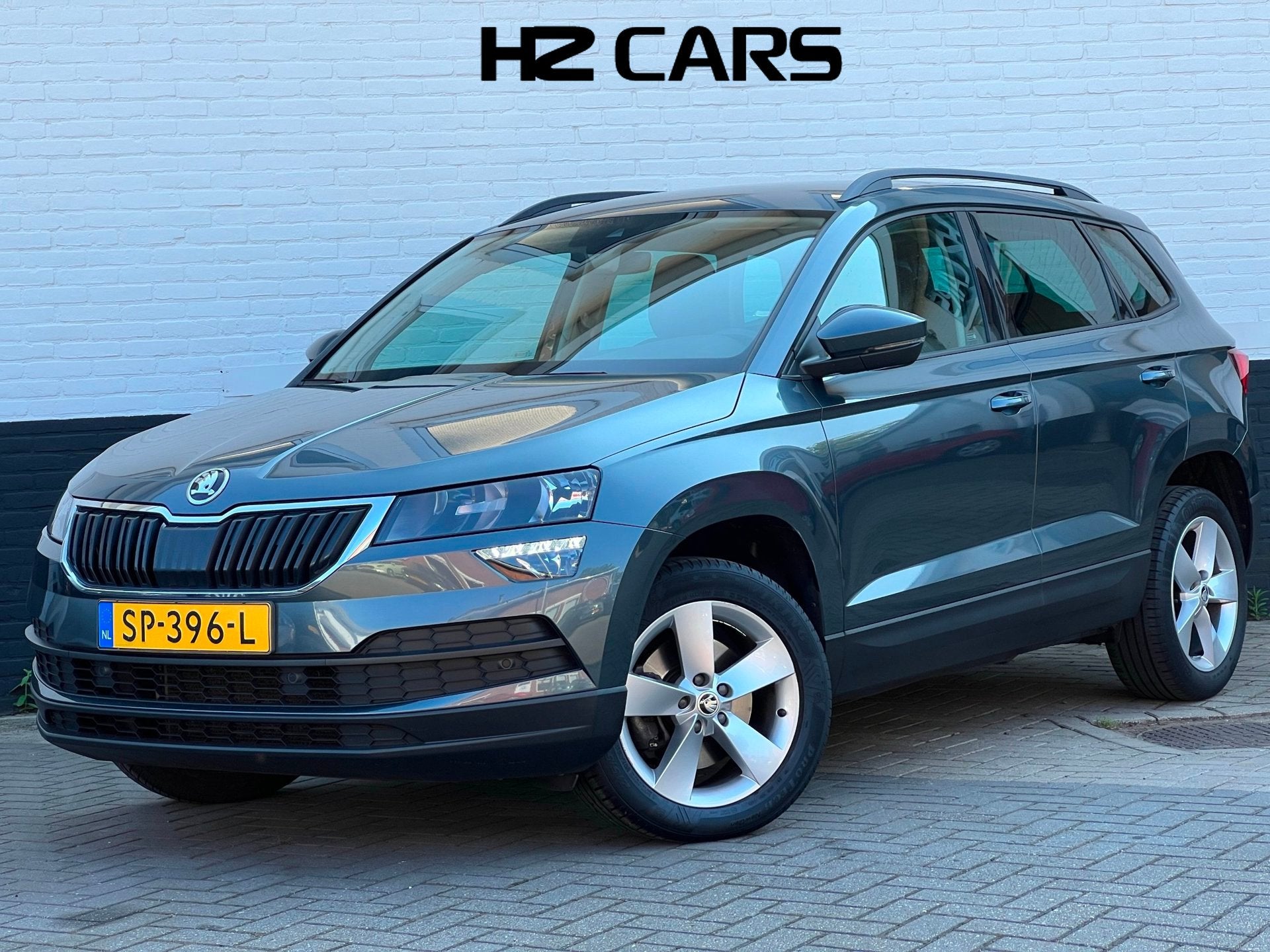 Skoda Karoq 1.5 TSI ACT Ambition Business|Trekhaak|Adaptive|, Auto's, Dealer onderhouden, Stof, 4 cilinders, 150 pk