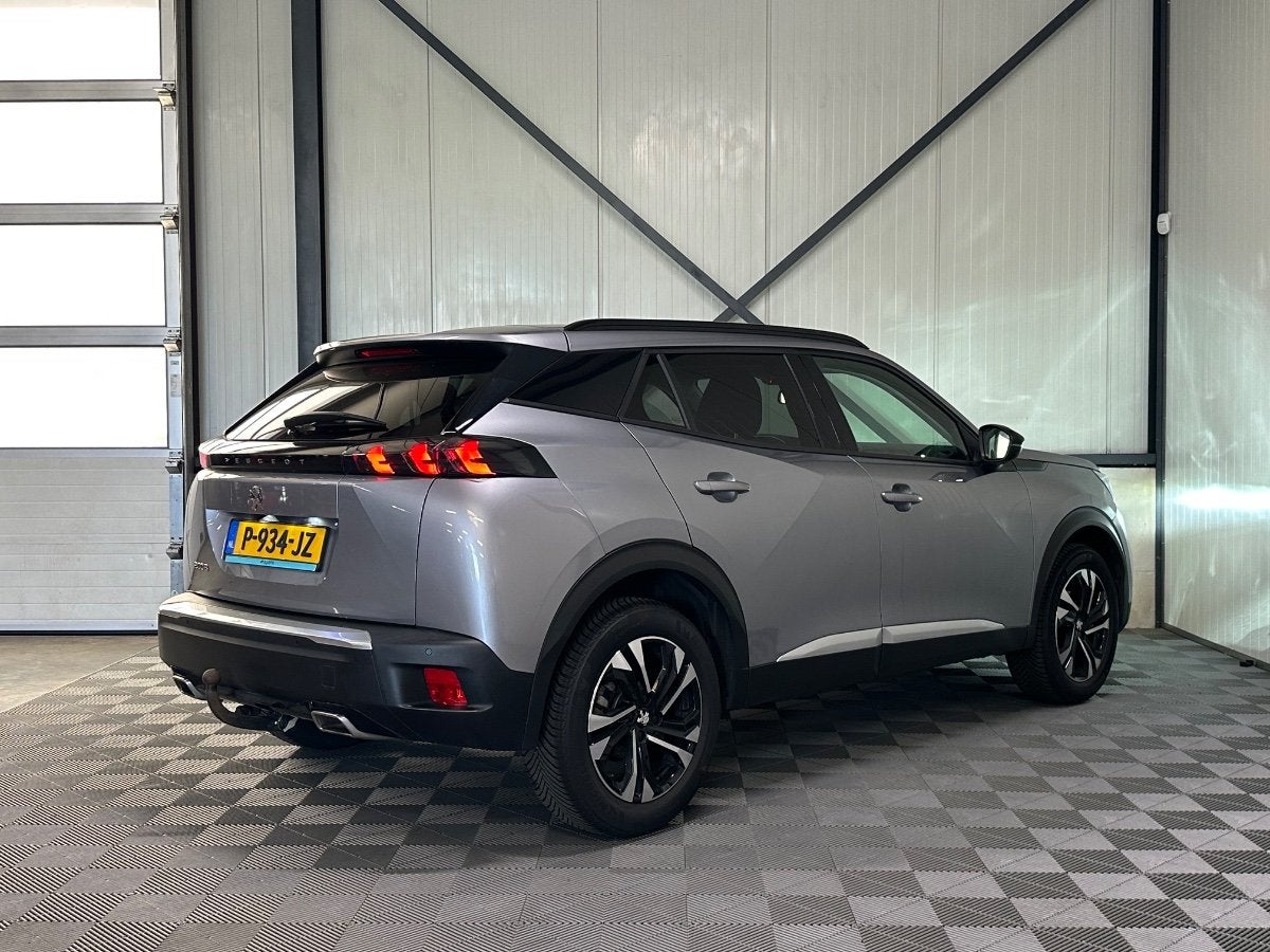 Peugeot 2008 1.2 PureTech Aut | Allure Pack | Navi | Camera, Auto's, Gebruikt, Euro 6, 1199 cc, Regensensor