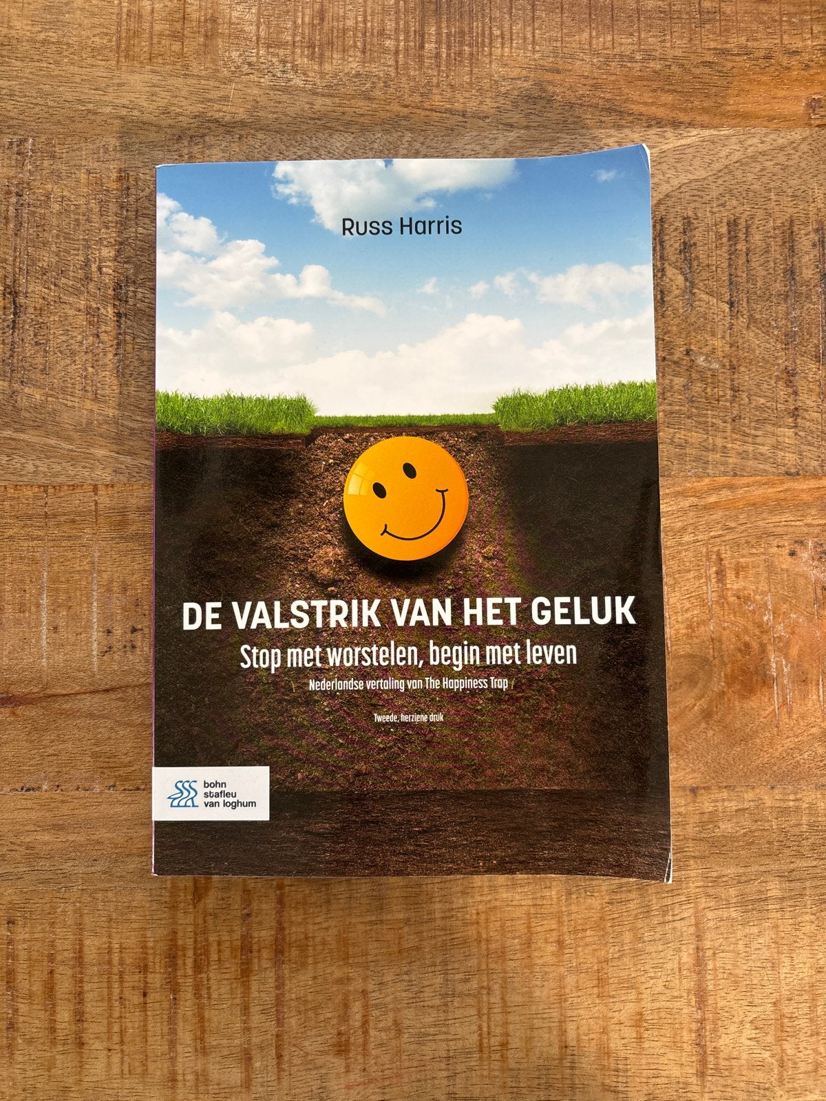 De Valstrik van het Geluk - Russ Harris (licht beschadigd), Ophalen of Verzenden, Zo goed als nieuw