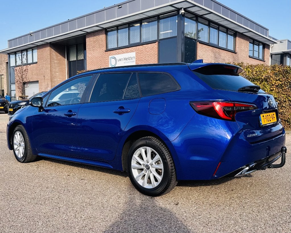 Toyota Corolla TS Hybrid 140 Business | FACELIFT, Auto's, 4 cilinders, Blauw, Corolla, Hybride Elektrisch/Benzine