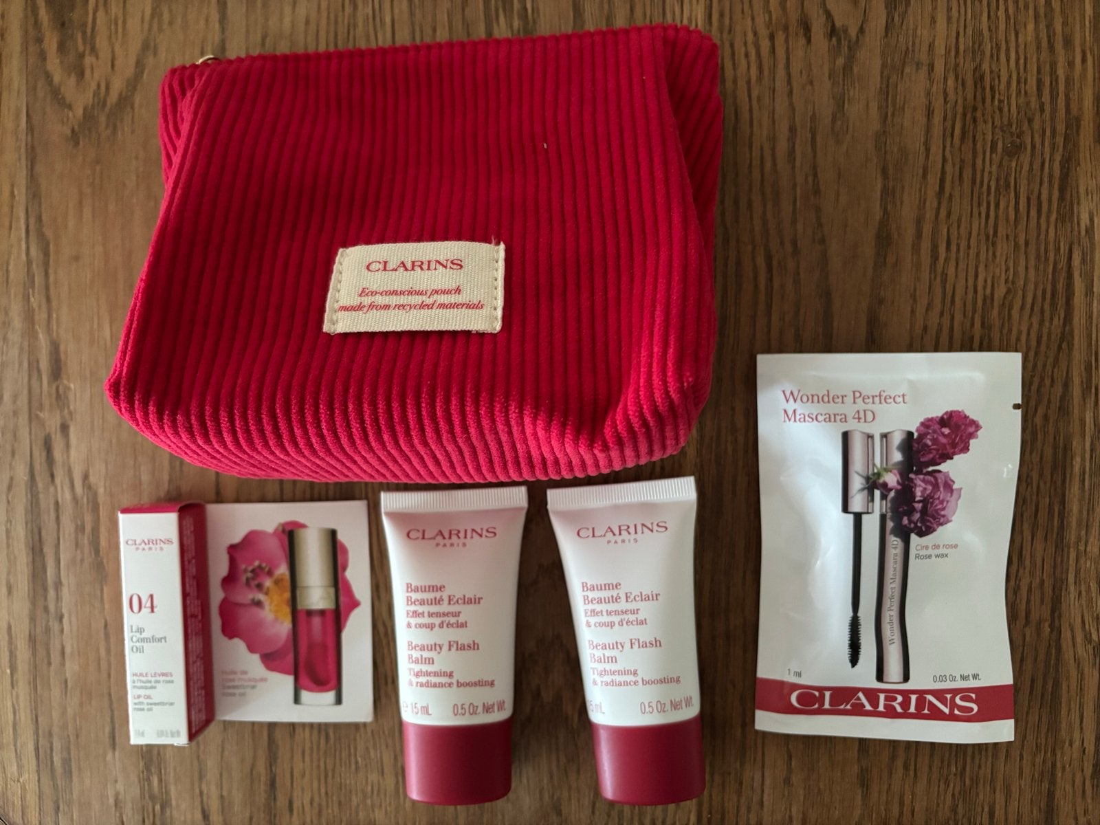 Luxe Clarins Glow & Glamour Cadeauset met Rode Rib Pouch, Gehele gezicht, Nieuw, Ophalen of Verzenden, Make-up