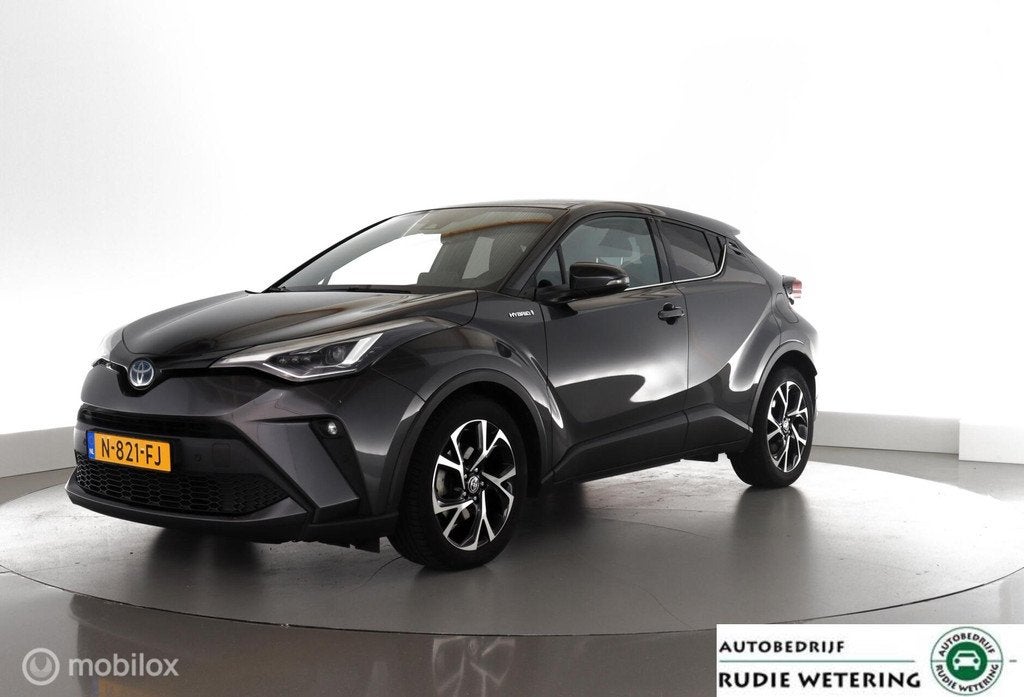 Toyota C-HR 1.8 Hybrid Style led|nav|dab|cam|ecc|acc|lmv18, Auto's, Stof, Euro 6, 4 cilinders, Met garantie (alle)