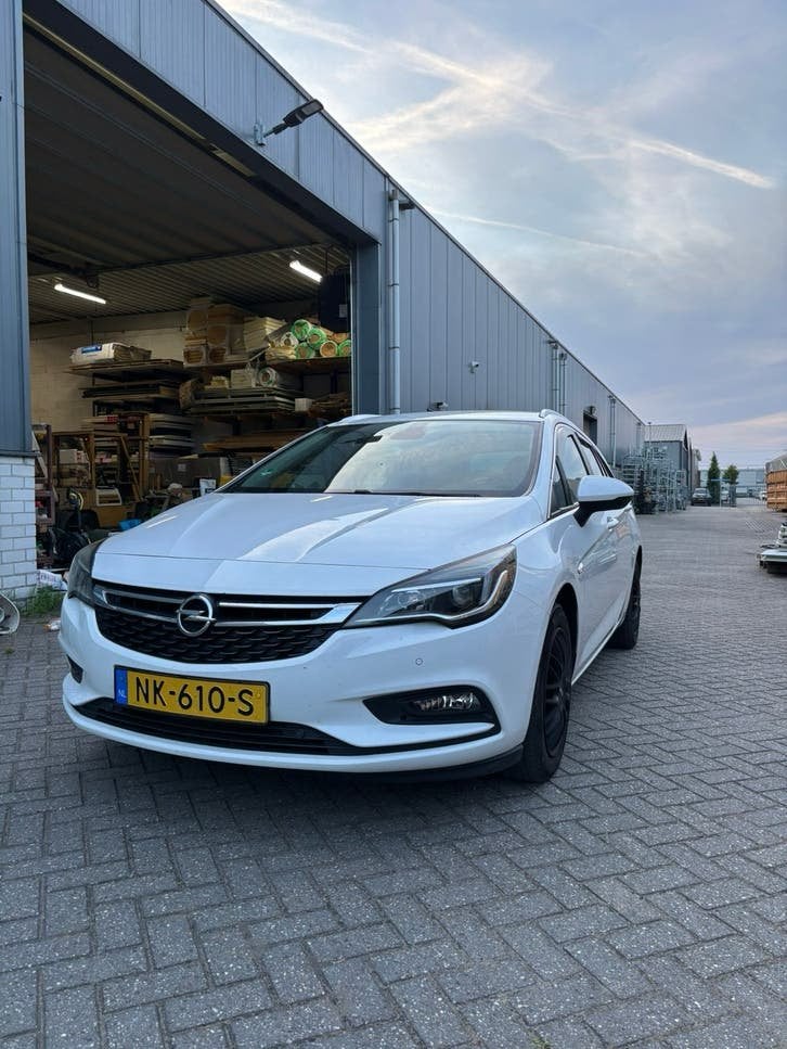 Opel Astra 1.0 Turbo 77KW Sports Tourer 2017 Wit, Auto's, Voorwielaandrijving, 1178 kg, 620 kg, Wit
