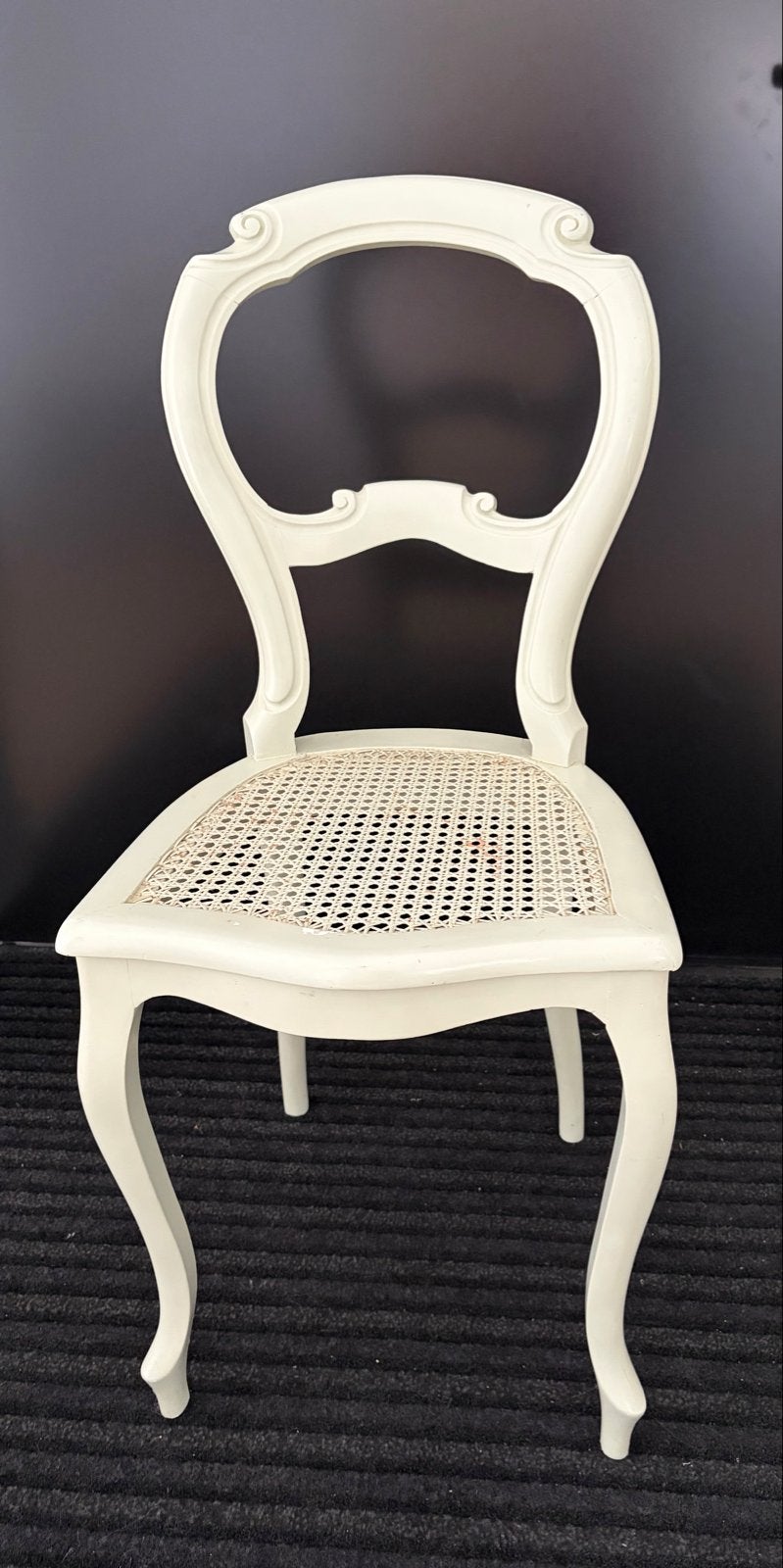 Antieke stoel met rotan zitting, Ophalen