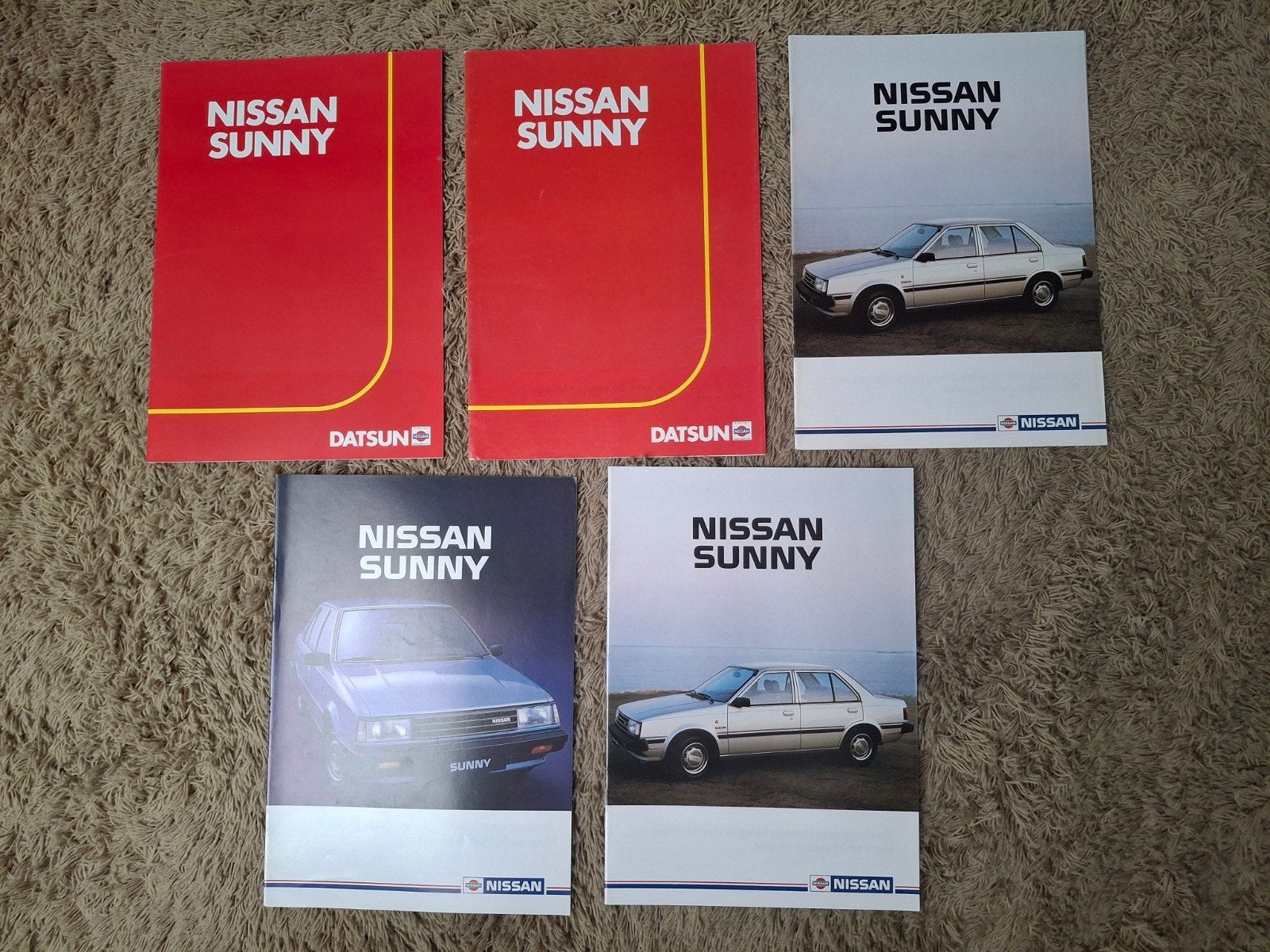 Lot autofolders Nissan Sunny B11, Verzenden, Nissan