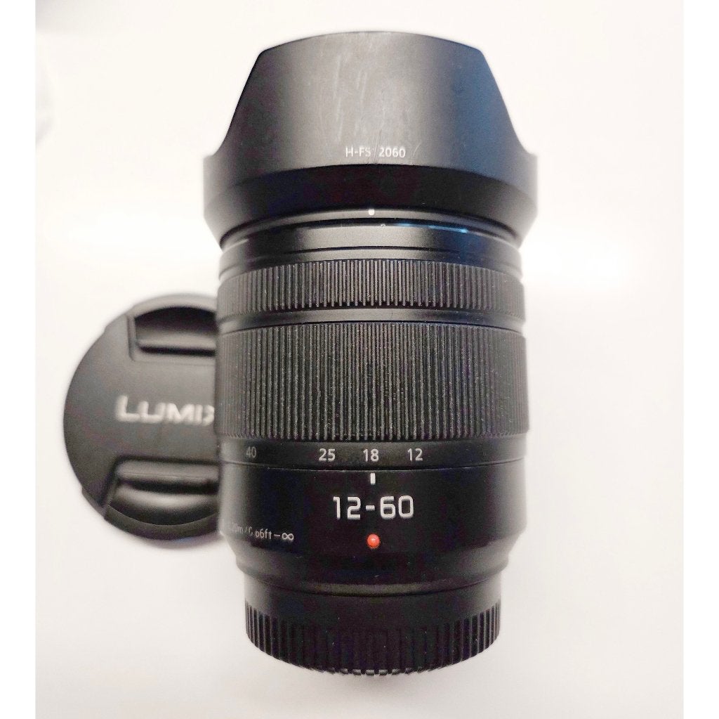 Panasonic Lumix lens 12-60 mm 3.5-5.6, Gebruikt, Overige typen, Ophalen of Verzenden, Zonnekap