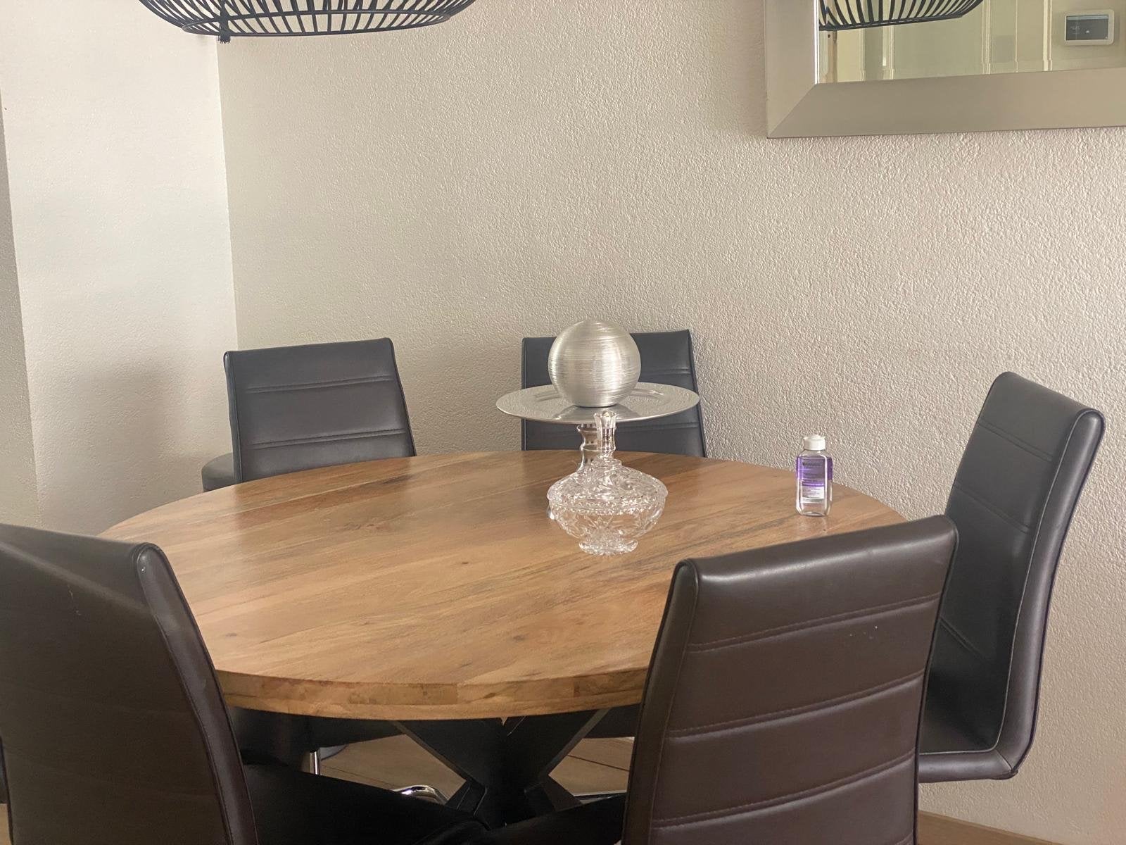 Ronde eettafel van mangohout met zwarte spinpoot, Gebruikt, 100 tot 150 cm, Rond, Ophalen of Verzenden