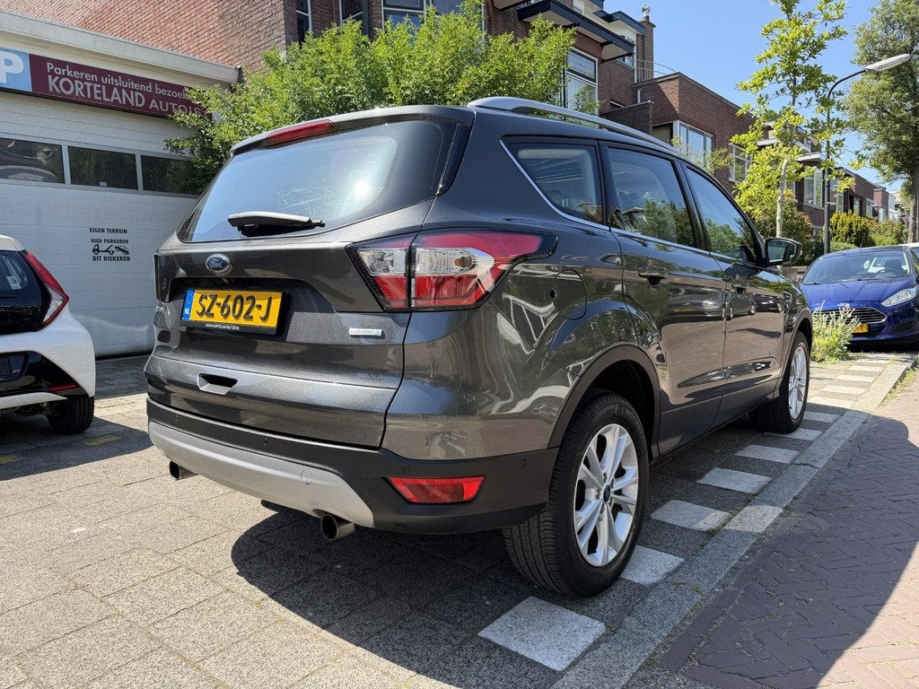 Ford Kuga 1.5 EcoBoost Titanium 4WD PANO NAVI CAMERA LEER, Auto's, Ford, Automaat, 4 cilinders, 1586 kg, Bedrijf