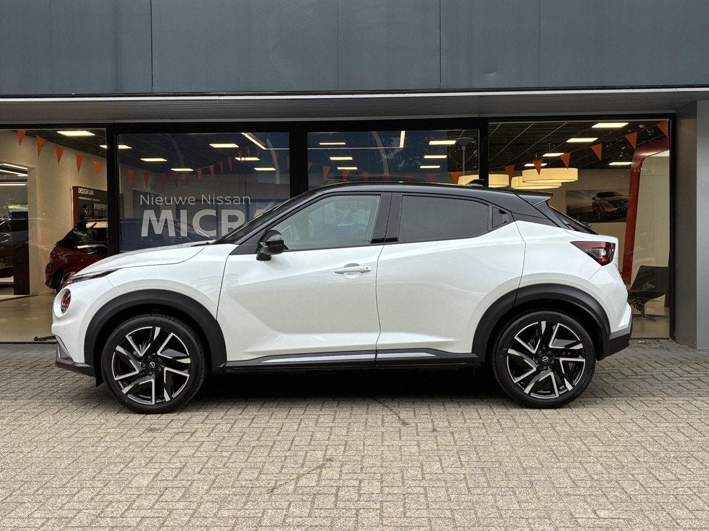 Nissan Juke 1.6 Hybrid N-Design NIEUW UIT VOORRAAD LEVERBAAR, Auto's, Nissan, Stof, Met garantie (alle), Wit, Bedrijf