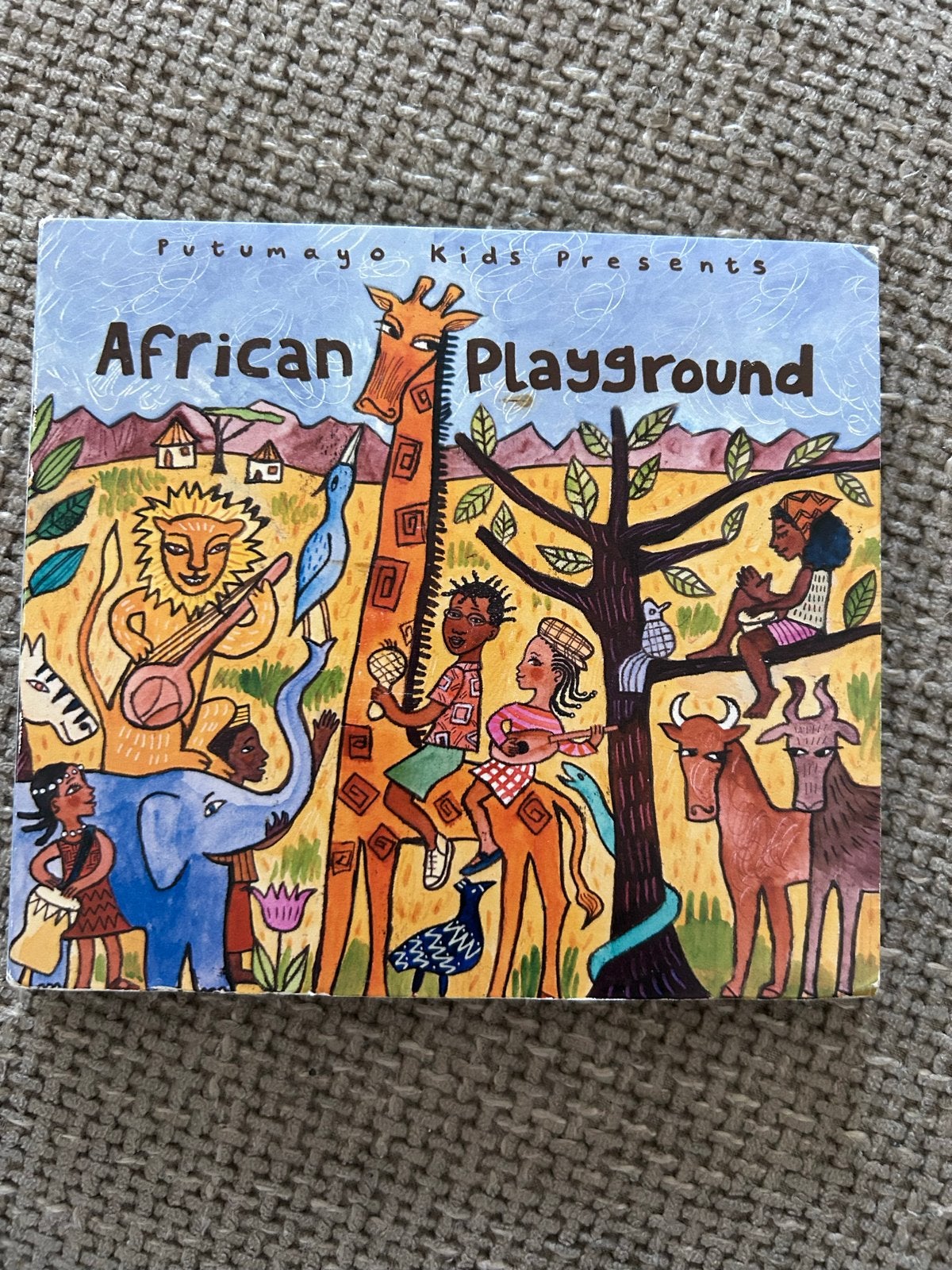 Putumayo Kids afrika Presents African Playground CD, Cd's en Dvd's, Cd's | Kinderen en Jeugd, Ophalen of Verzenden, Inclusief boekje