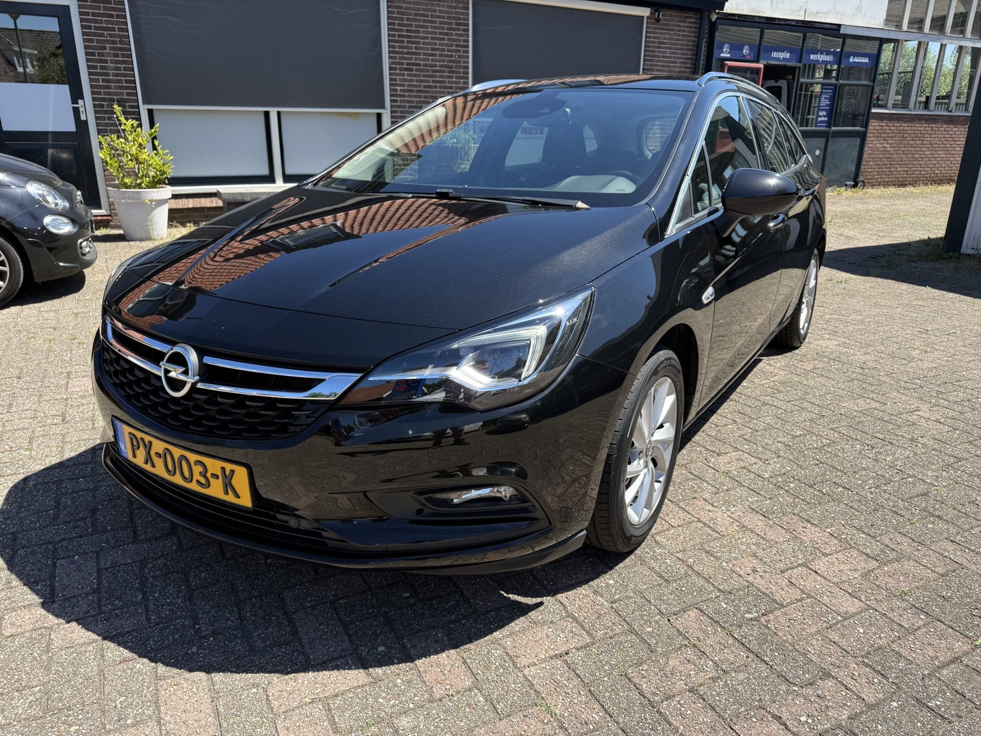 Opel Astra Sports Tourer 1.4 Innovation (bj 2017, automaat), Auto's, Opel, Stof, Gebruikt, 150 pk, Zwart