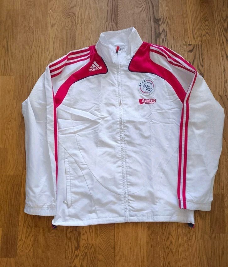 Ajax Adidas trainingsjack met sponsor aegon, Ophalen