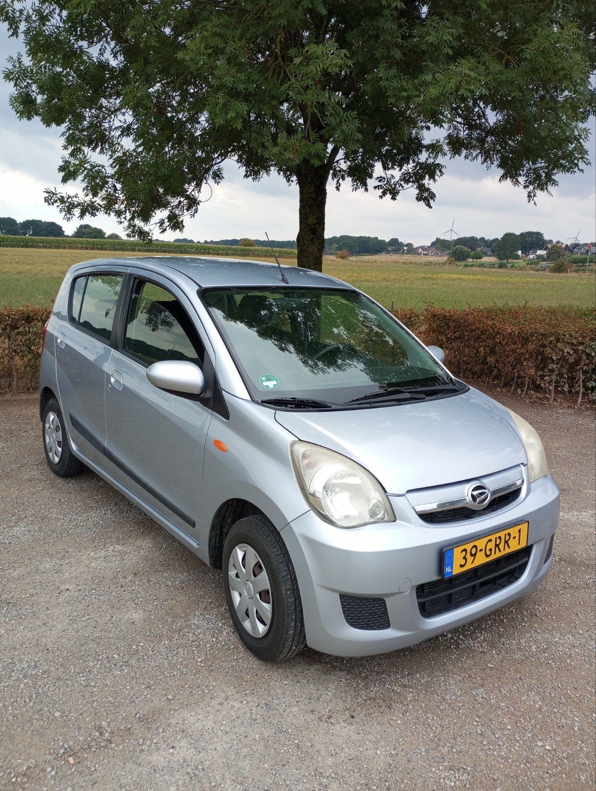 Daihatsu Cuore 1.0  2008 Zilvermetallic APK tot 30 Aug2027, Voorwielaandrijving, Stof, 600 kg, Zwart