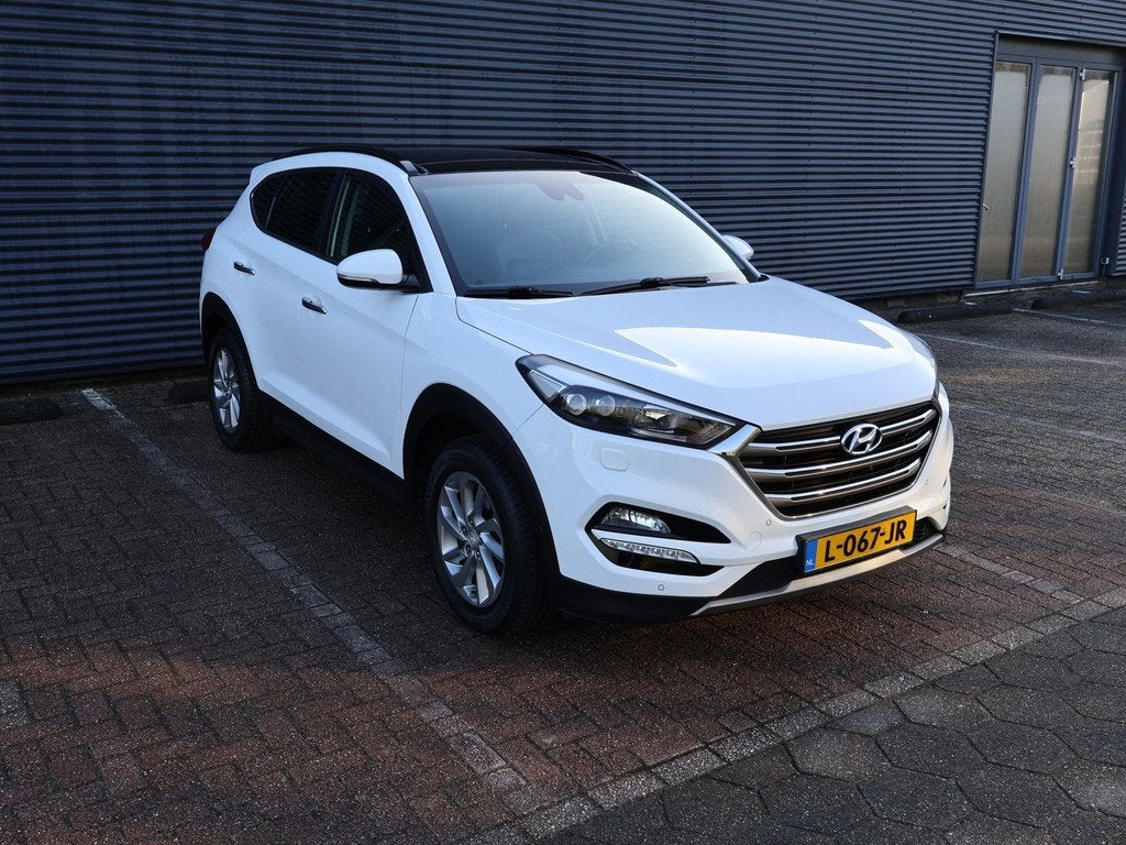 Hyundai Tucson 1.6 T-GDi Comfort 4WD Pano Camera Navi Keyles, Auto's, Hyundai, Gebruikt, 4 cilinders, Wit, Leder