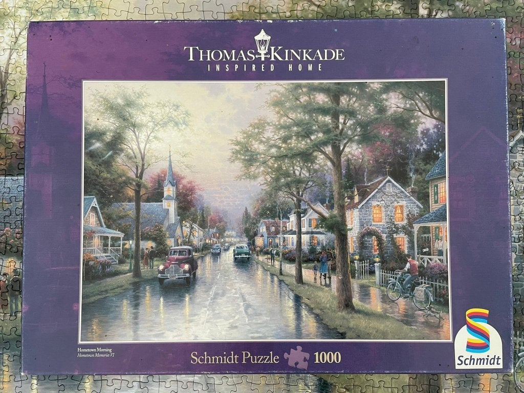 Schmidt thomas kinkade puzzel 1000 st hometown morning!, Ophalen of Verzenden, 500 t/m 1500 stukjes, Zo goed als nieuw