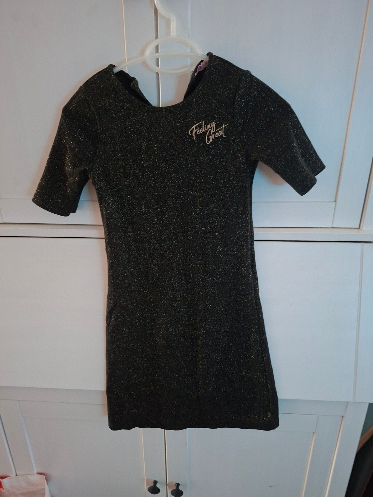WE meisjes jurk zwart met glitter, maat 134/140, Kinderen en Baby's, Kinderkleding | Maat 134, Ophalen, WE, Meisje, Zo goed als nieuw