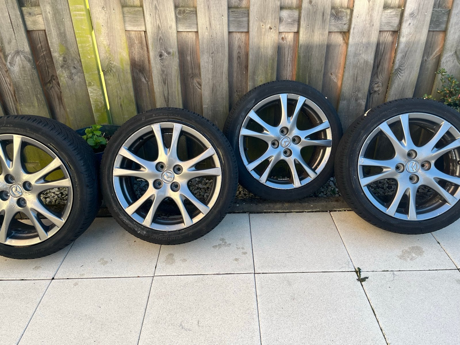 4x Mazda 2 velgen met uitstekende Kinergy 4S2 All Season, Ophalen, Gebruikt, 16 inch, Banden en Velgen