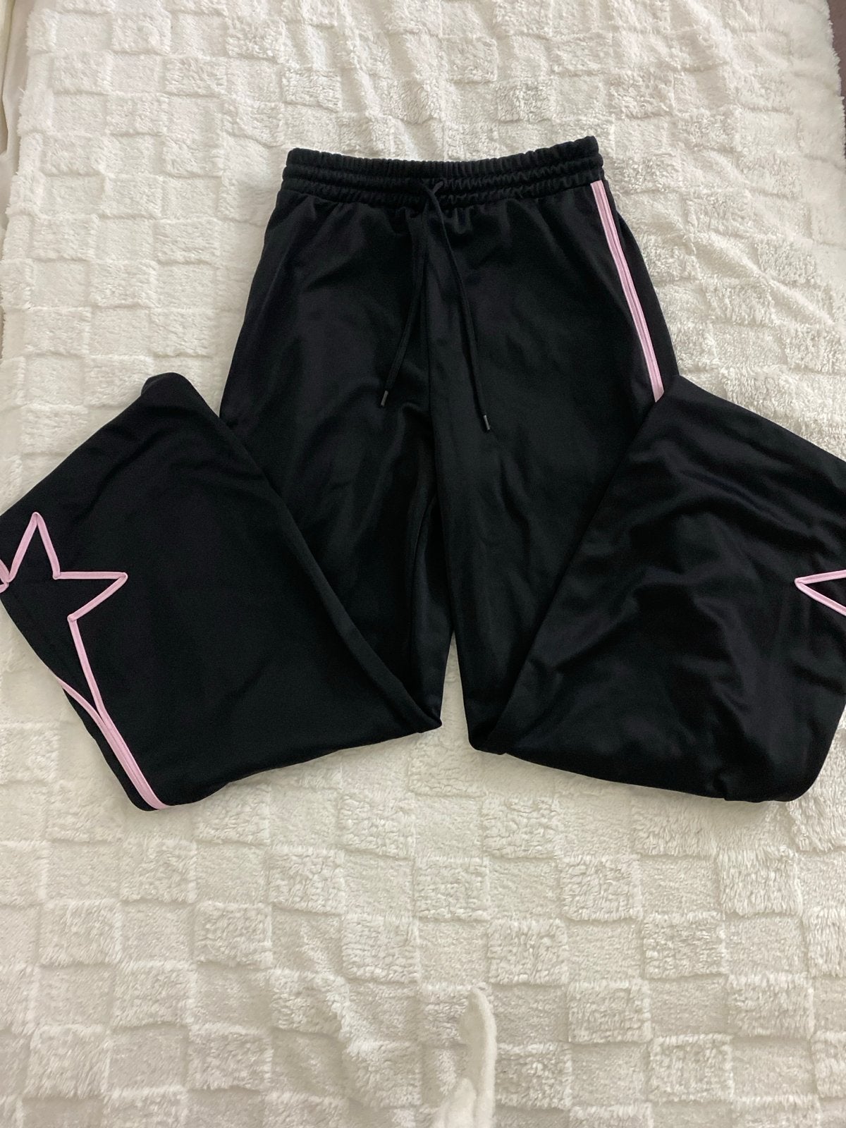 Zwarte broek met roze strepen en sterren, Maat 38/40 (M), Zwart, Ophalen of Verzenden, Zo goed als nieuw