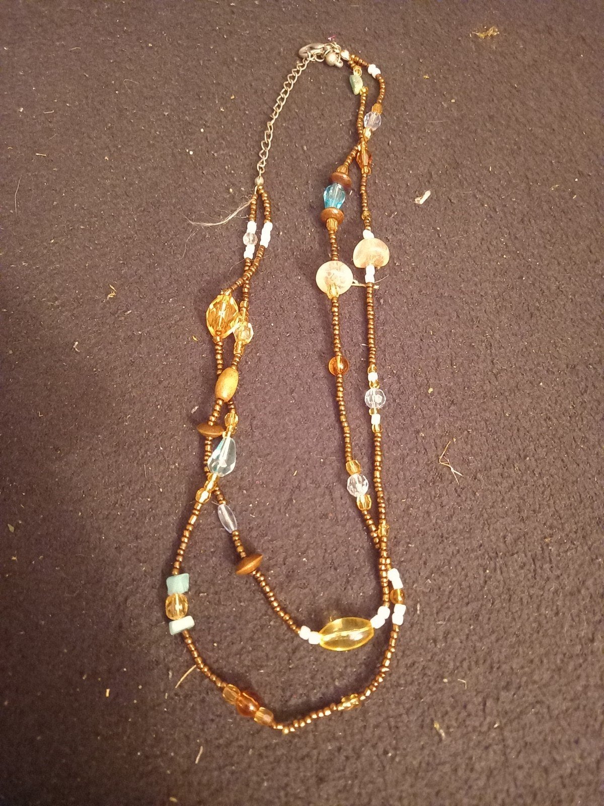 Mooie kralenketting in warme tinten, Ophalen of Verzenden, Gebruikt, Overige kleuren, Overige materialen