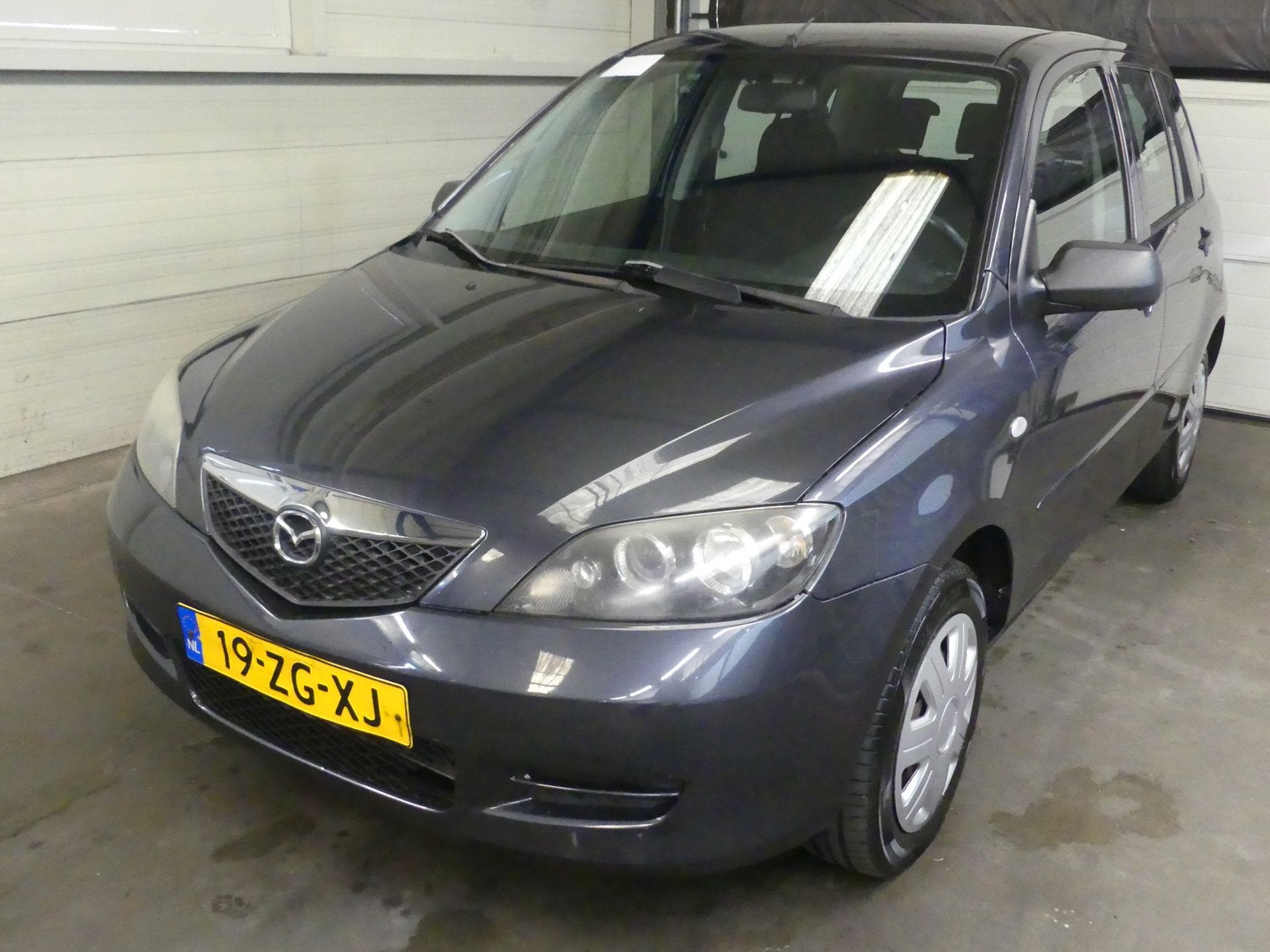Mazda 2 1.4 Exclusive - Trekhaak - Airco, Voorwielaandrijving, 1025 kg, Gebruikt, 4 cilinders
