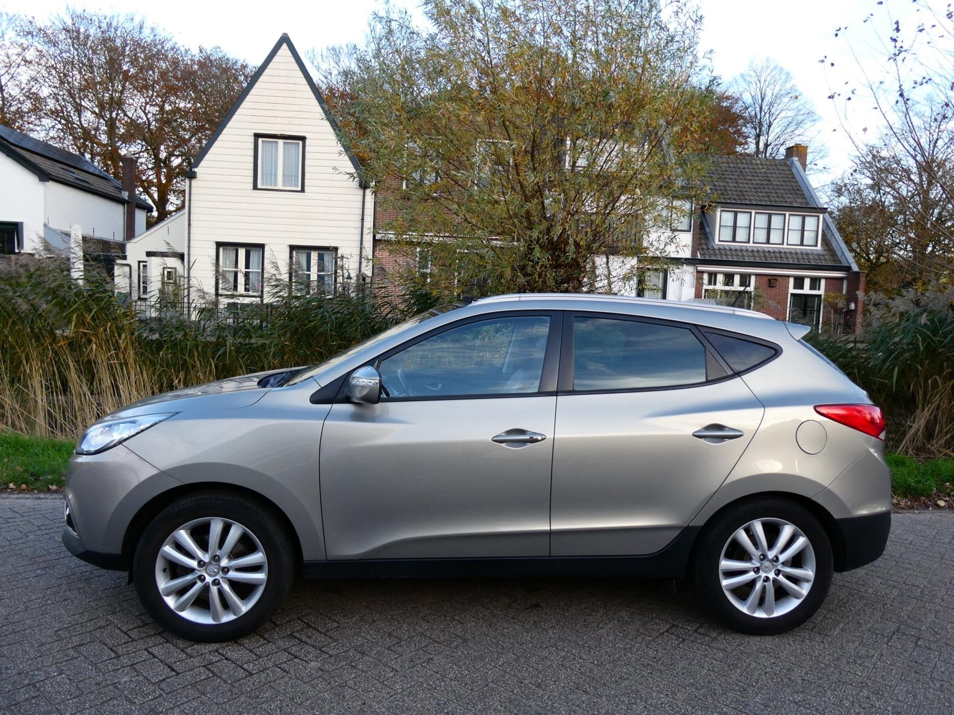 Hyundai Ix35 2.0i i-Catcher 163pk 2e eig. Clima Navi Leder T, Gebruikt, Zwart, 4 cilinders, Stoelverwarming